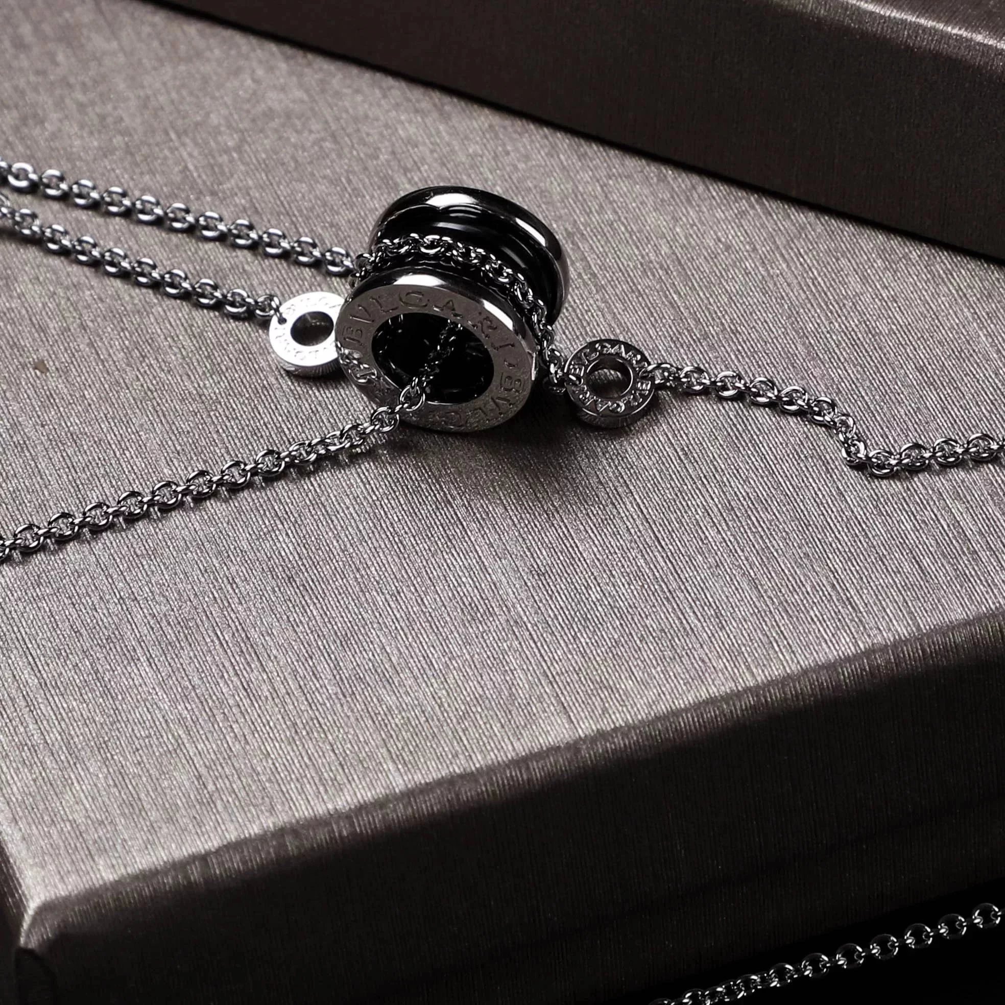 Item ID 8372 Baoge -BGR- Takaraya - Charity Little Red Man Black Ceramic Pendant S9