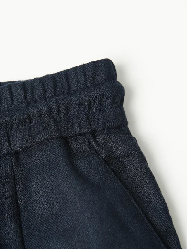 Item ID 9079 BC natural linen rolled edge shorts with double pleat design, drawstring, elastic waistband, and pleated casual shorts