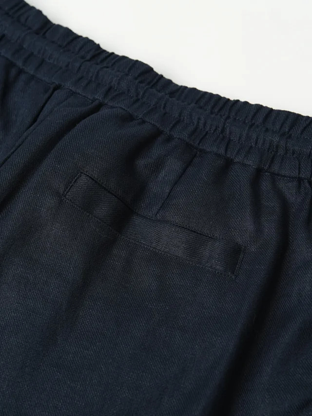 Item ID 9079 BC natural linen rolled edge shorts with double pleat design, drawstring, elastic waistband, and pleated casual shorts
