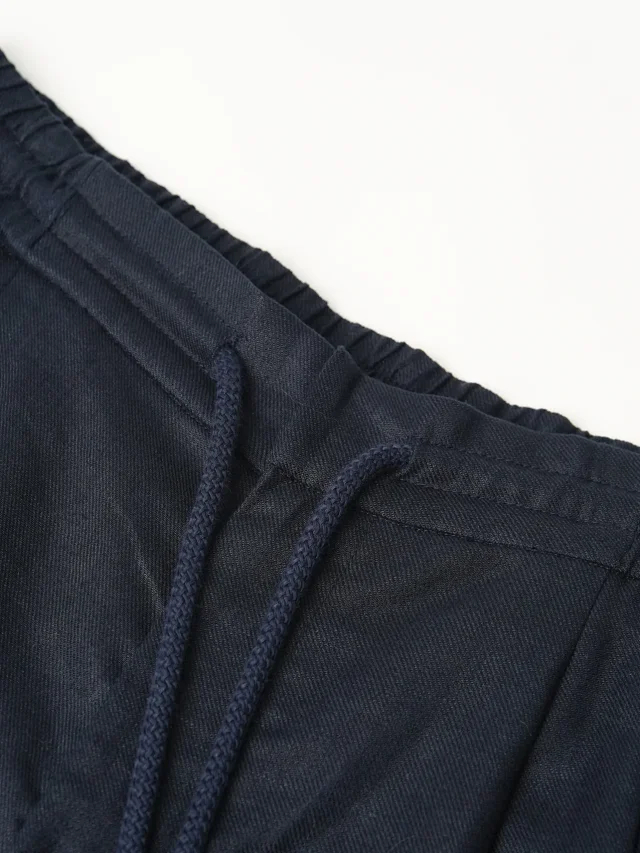 Item ID 9079 BC natural linen rolled edge shorts with double pleat design, drawstring, elastic waistband, and pleated casual shorts