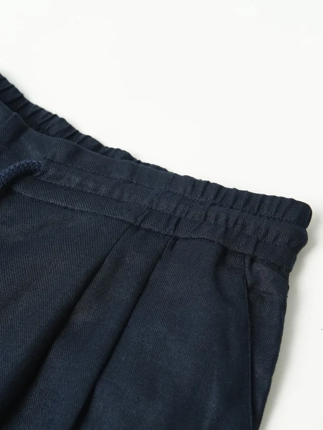Item ID 9079 BC natural linen rolled edge shorts with double pleat design, drawstring, elastic waistband, and pleated casual shorts