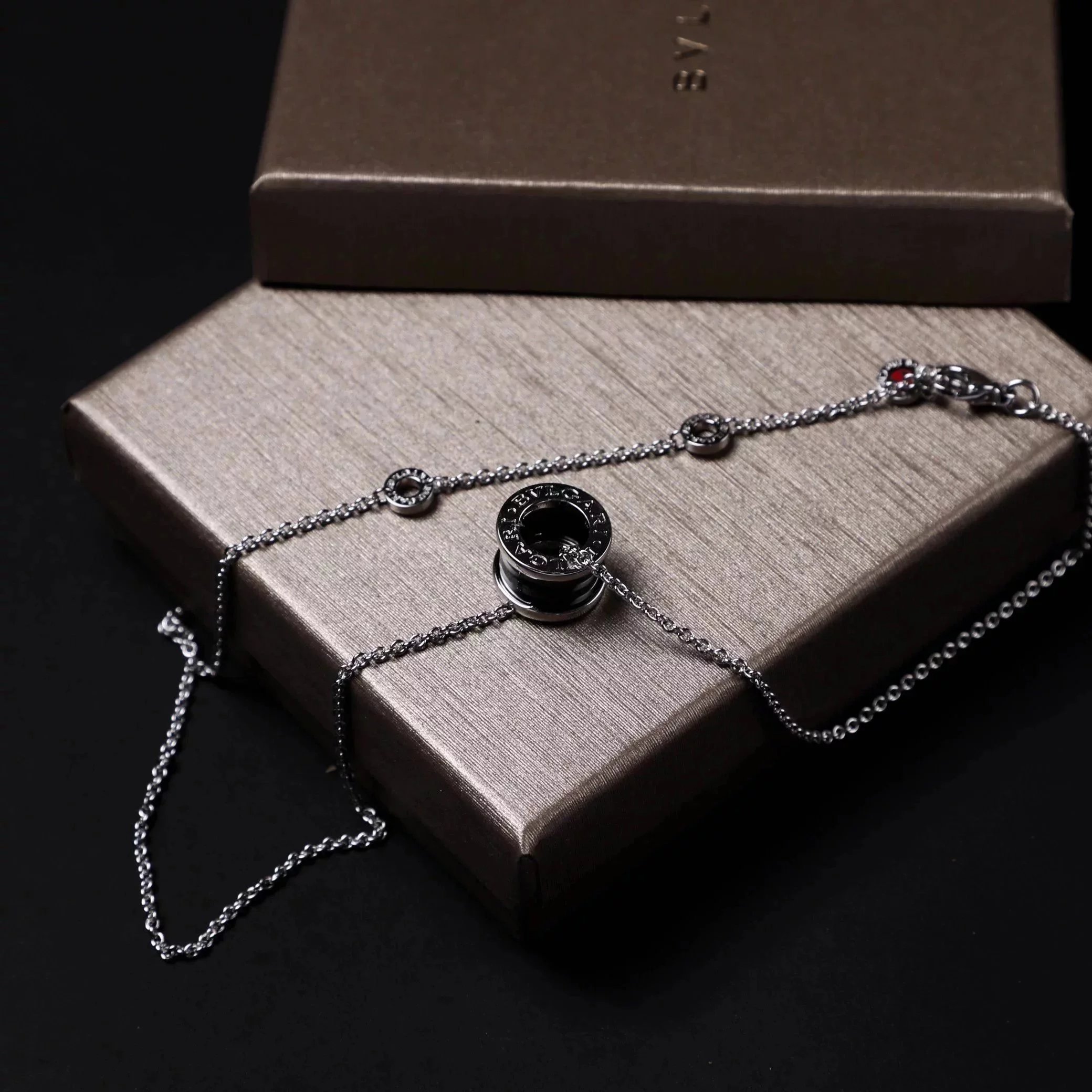 Item ID 8372 Baoge -BGR- Takaraya - Charity Little Red Man Black Ceramic Pendant S9