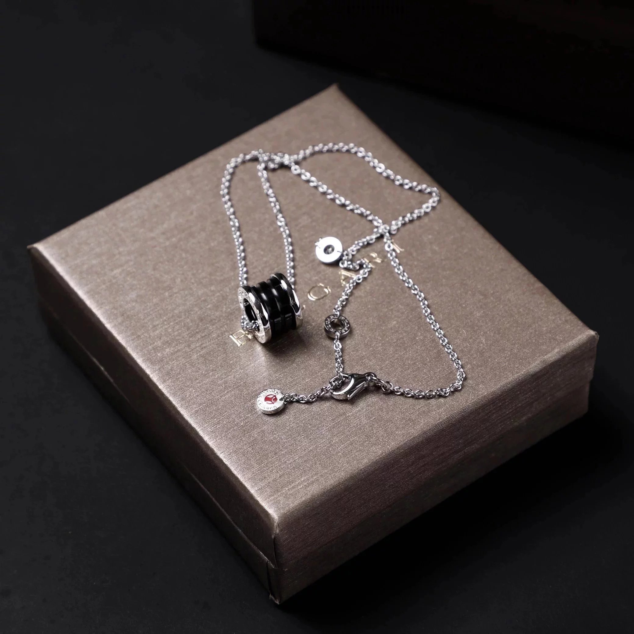 Item ID 8372 Baoge -BGR- Takaraya - Charity Little Red Man Black Ceramic Pendant S9