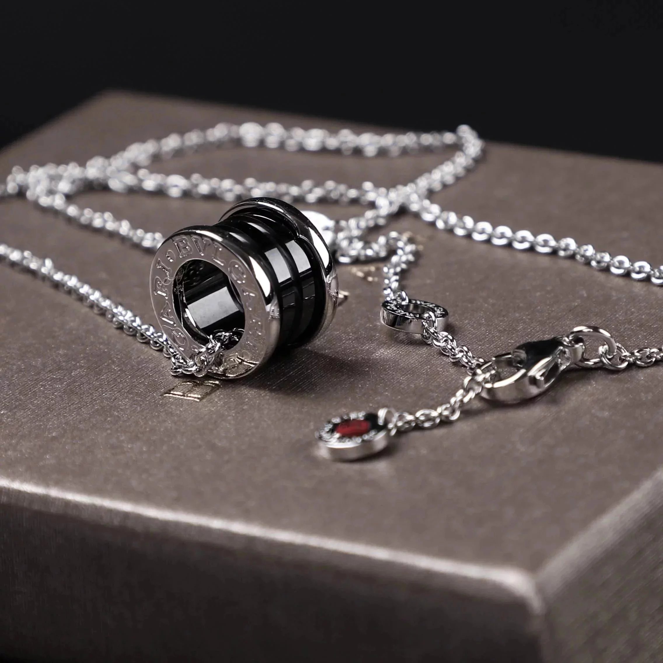 Item ID 8372 Baoge -BGR- Takaraya - Charity Little Red Man Black Ceramic Pendant S9