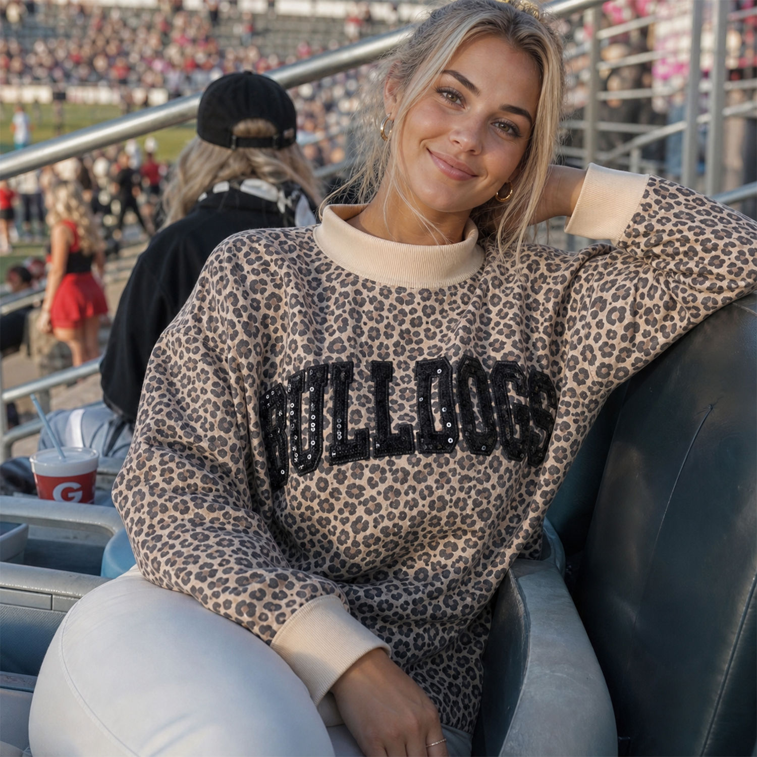 Girl in Bulldogs leopard print mock neck pullover, stadium tailgate outfit