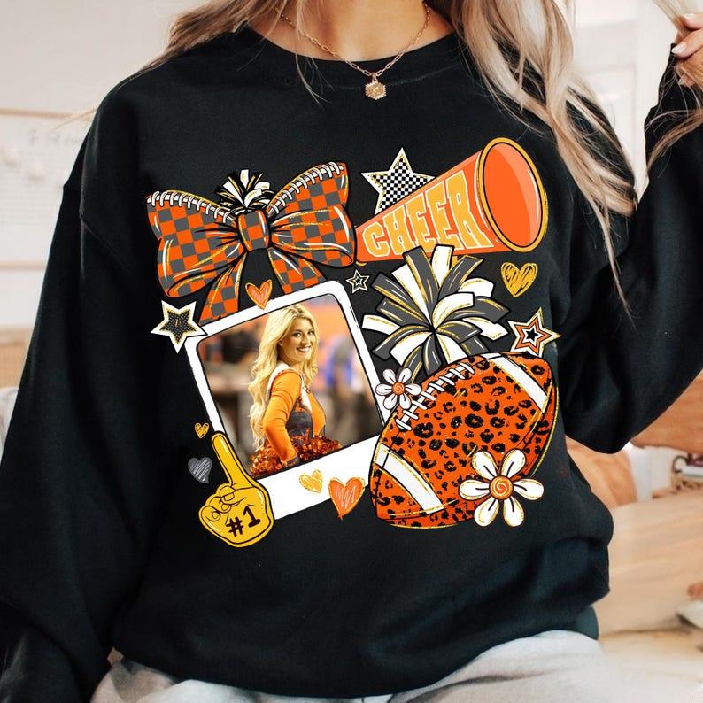 Customize The Vibrant Orange Campus Cheerleading Football Photo Sweatshirt To Capture Your Most Unforgettable Moments.