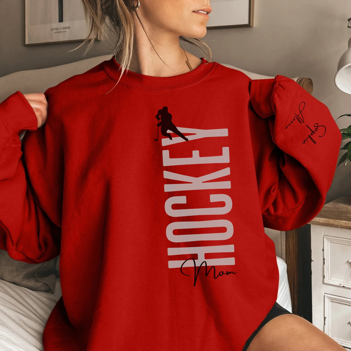 Personalized Hockey Sweatshirt With Softball Player's Name Printed On The Sleeve