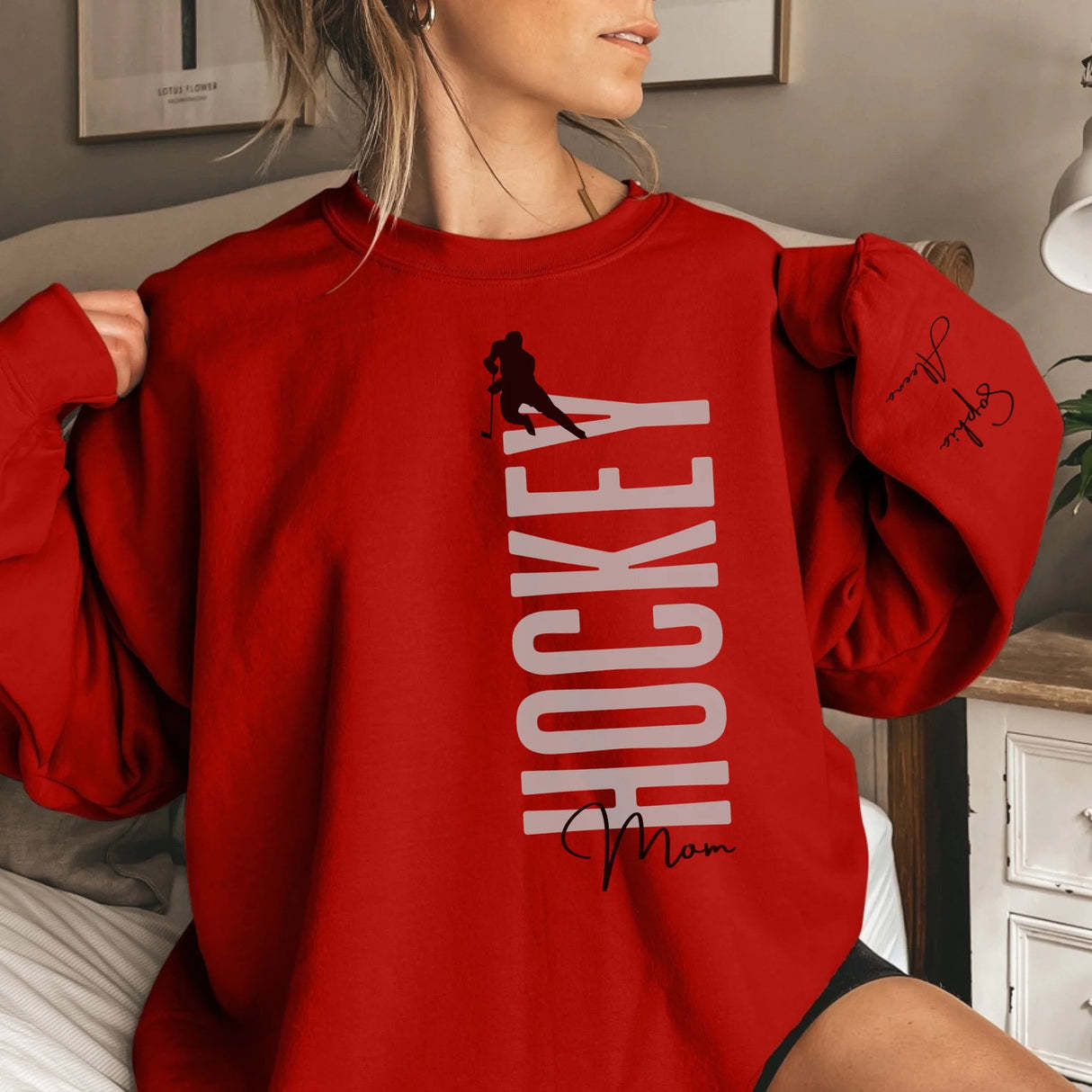 Personalized Hockey Sweatshirt With Softball Player's Name Printed On The Sleeve