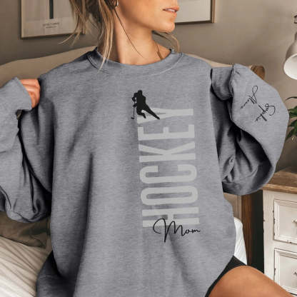 Personalized Hockey Sweatshirt With Softball Player's Name Printed On The Sleeve