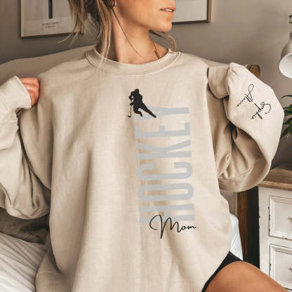 Personalized Hockey Sweatshirt With Softball Player's Name Printed On The Sleeve
