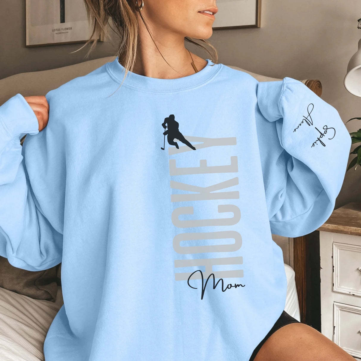 Personalized Hockey Sweatshirt With Softball Player's Name Printed On The Sleeve