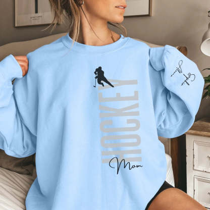 Personalized Hockey Sweatshirt With Softball Player's Name Printed On The Sleeve