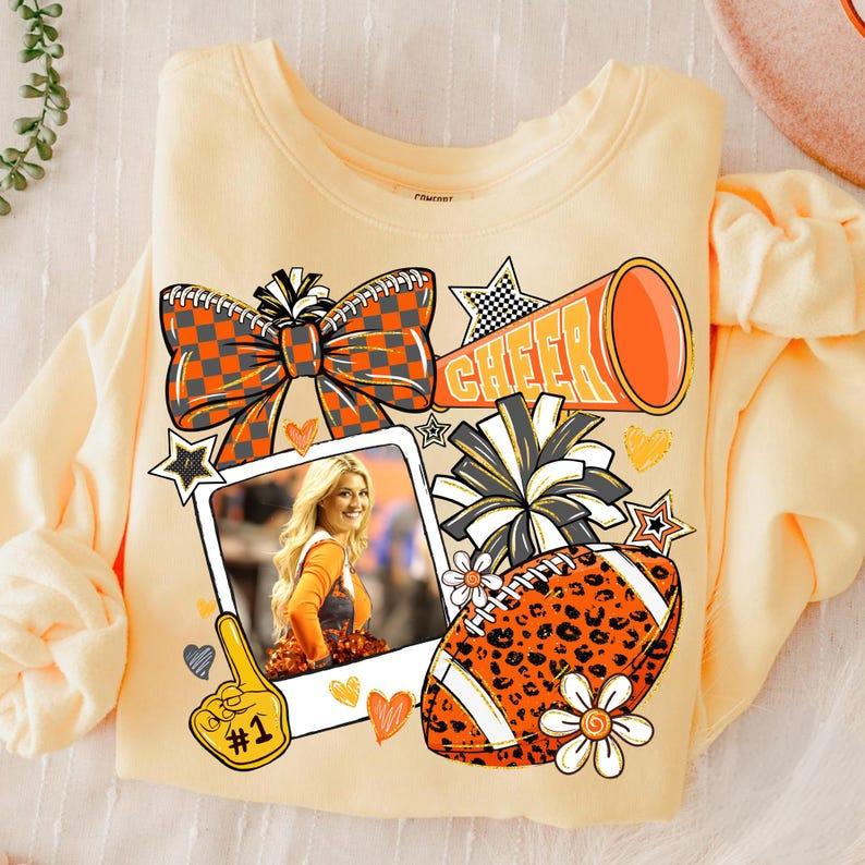 Customize The Vibrant Orange Campus Cheerleading Football Photo Sweatshirt To Capture Your Most Unforgettable Moments.