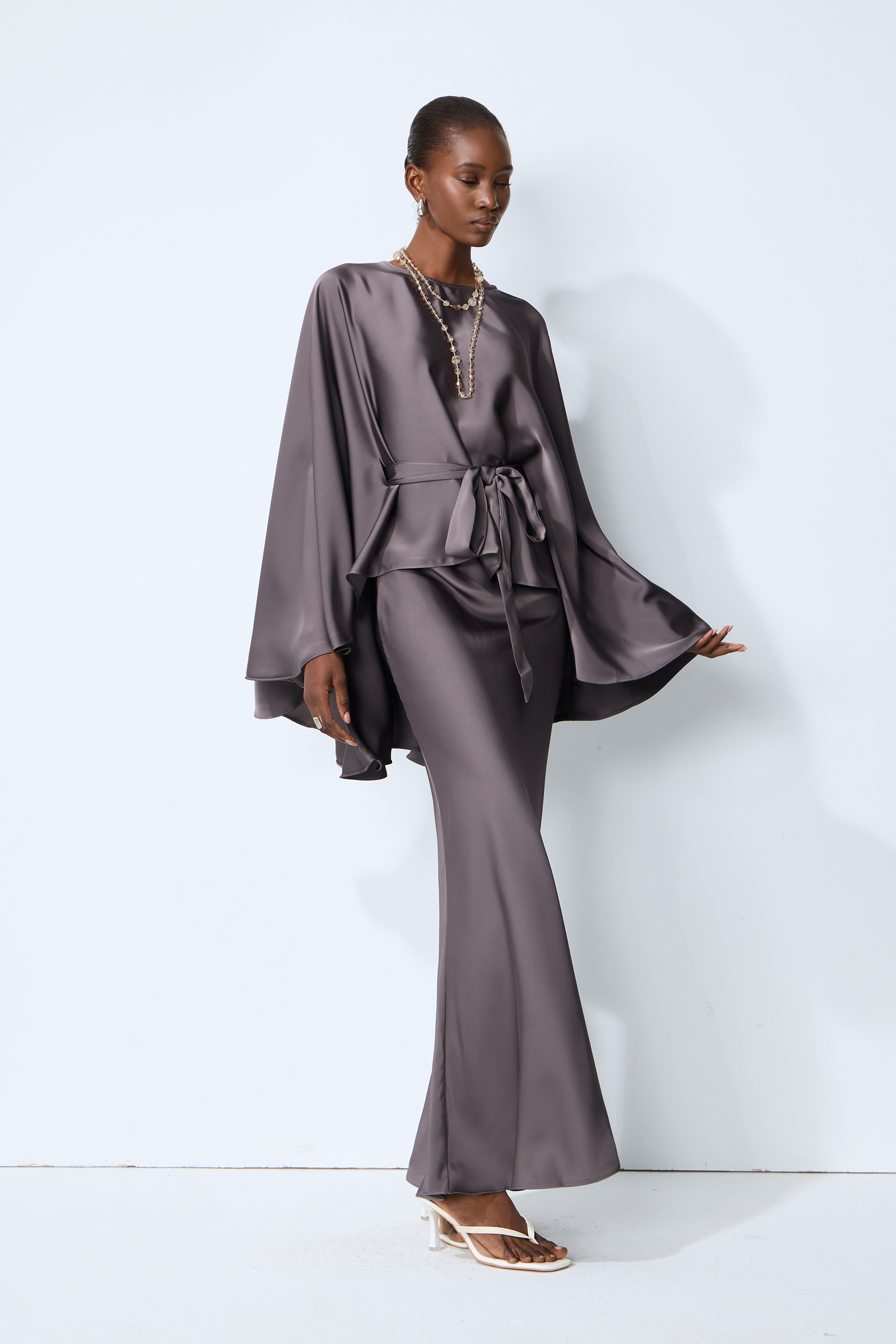 Exceptionally Graceful Grey Satin Cape Sleeve Top & Skirt Set