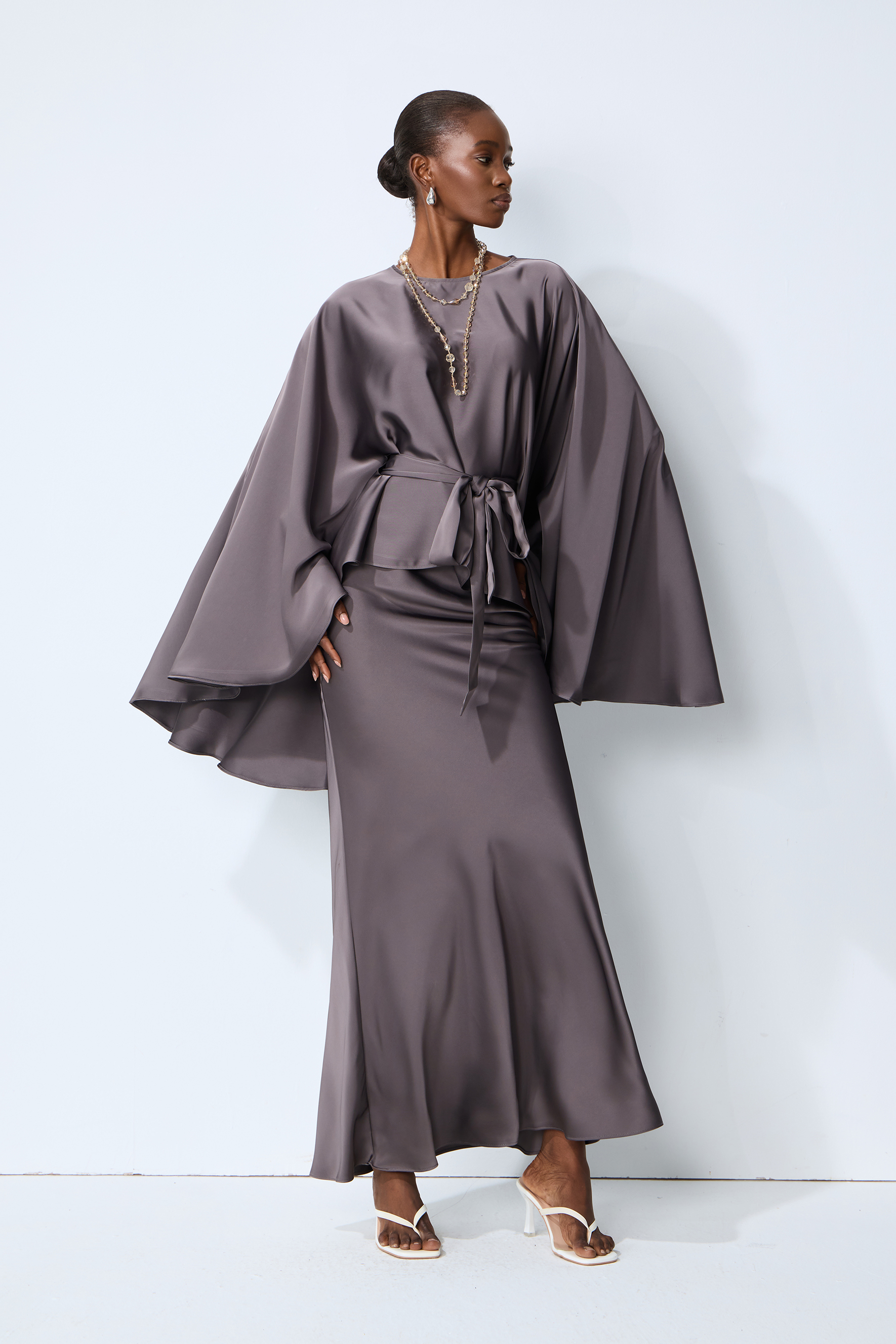 Exceptionally Graceful Grey Satin Cape Sleeve Top & Skirt Set