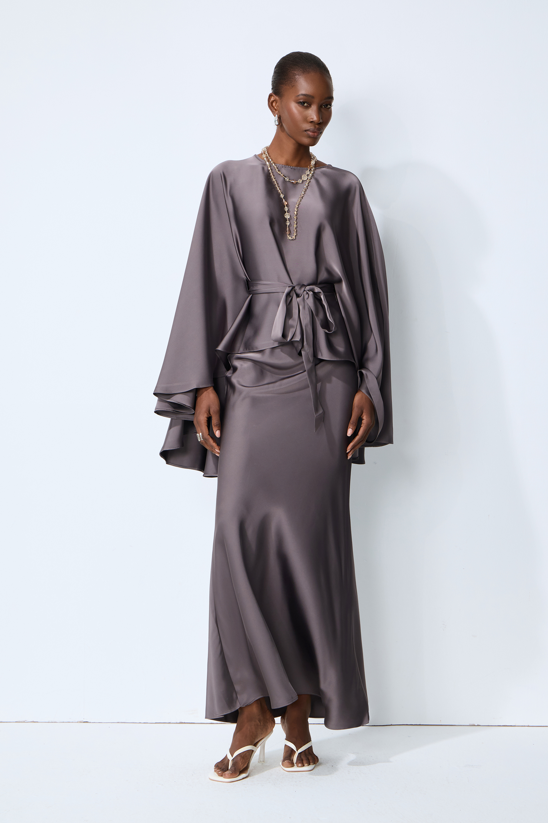 Exceptionally Graceful Grey Satin Cape Sleeve Top & Skirt Set