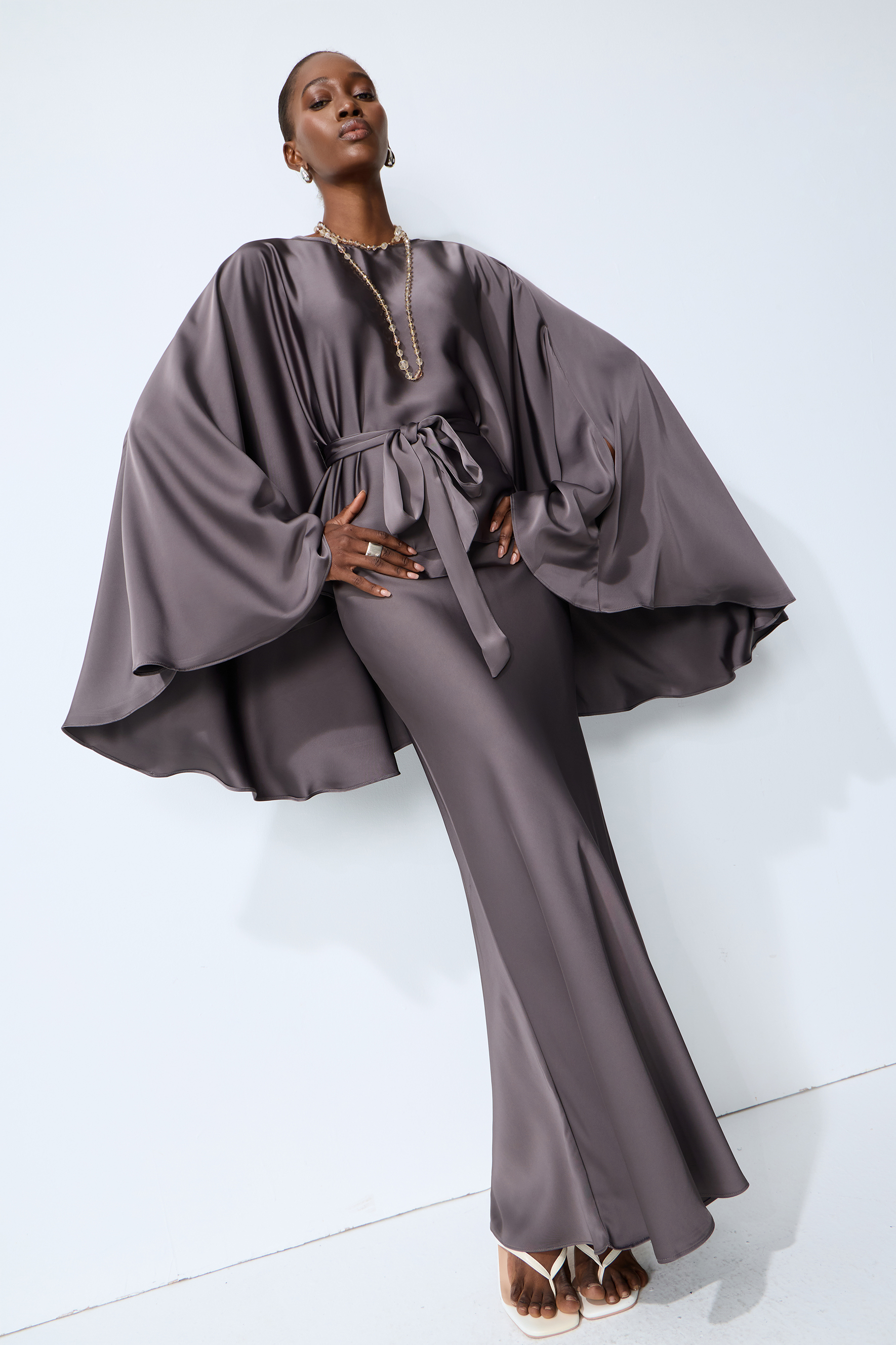 Exceptionally Graceful Grey Satin Cape Sleeve Top & Skirt Set