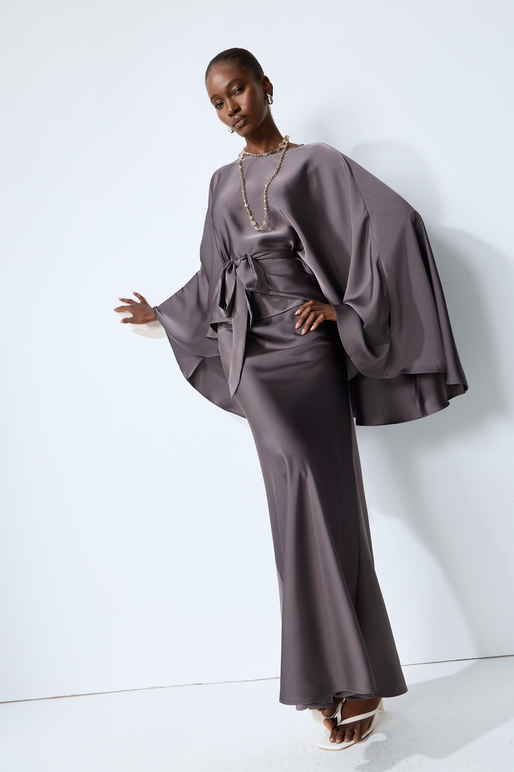 Exceptionally Graceful Grey Satin Cape Sleeve Top & Skirt Set