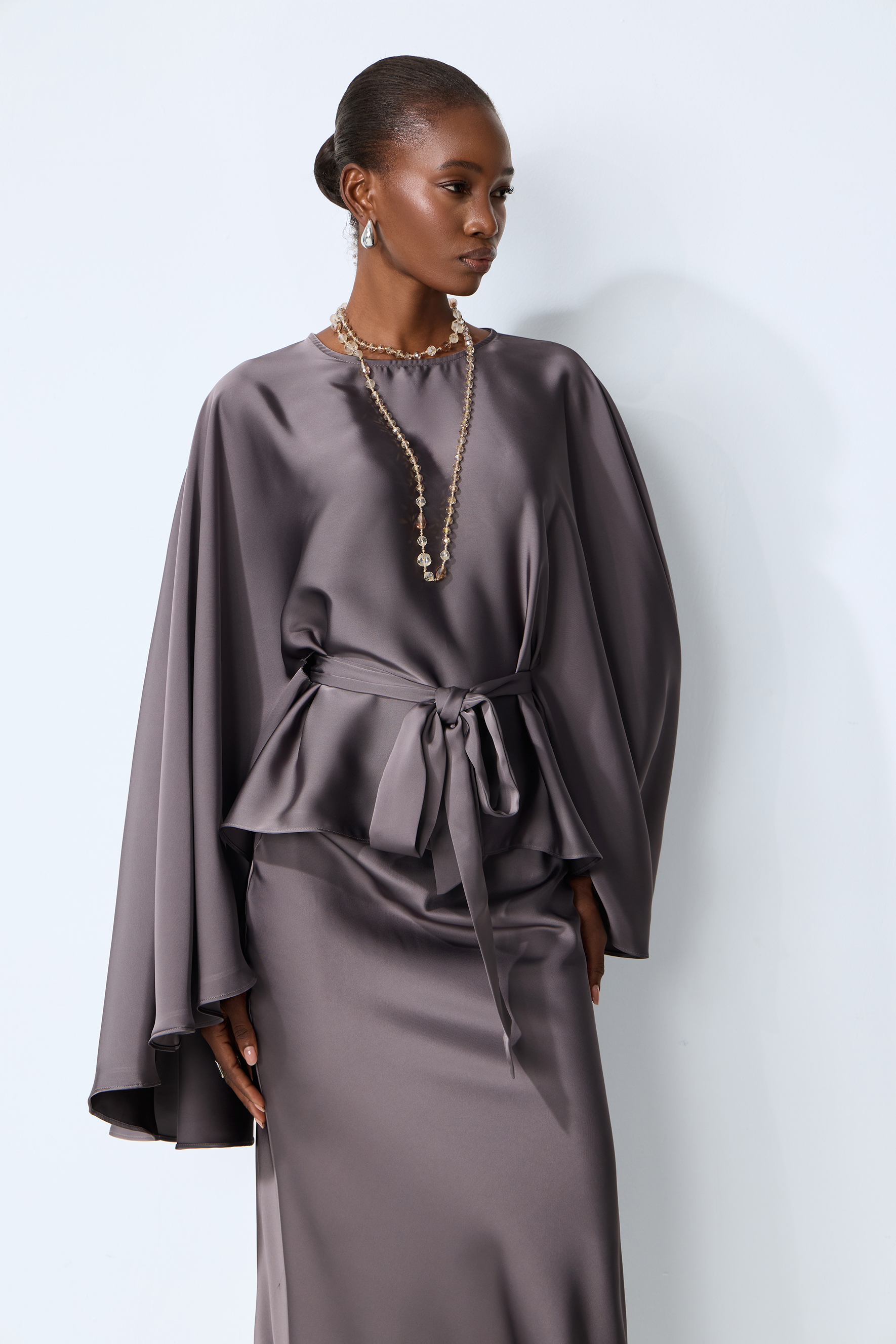 Exceptionally Graceful Grey Satin Cape Sleeve Top & Skirt Set