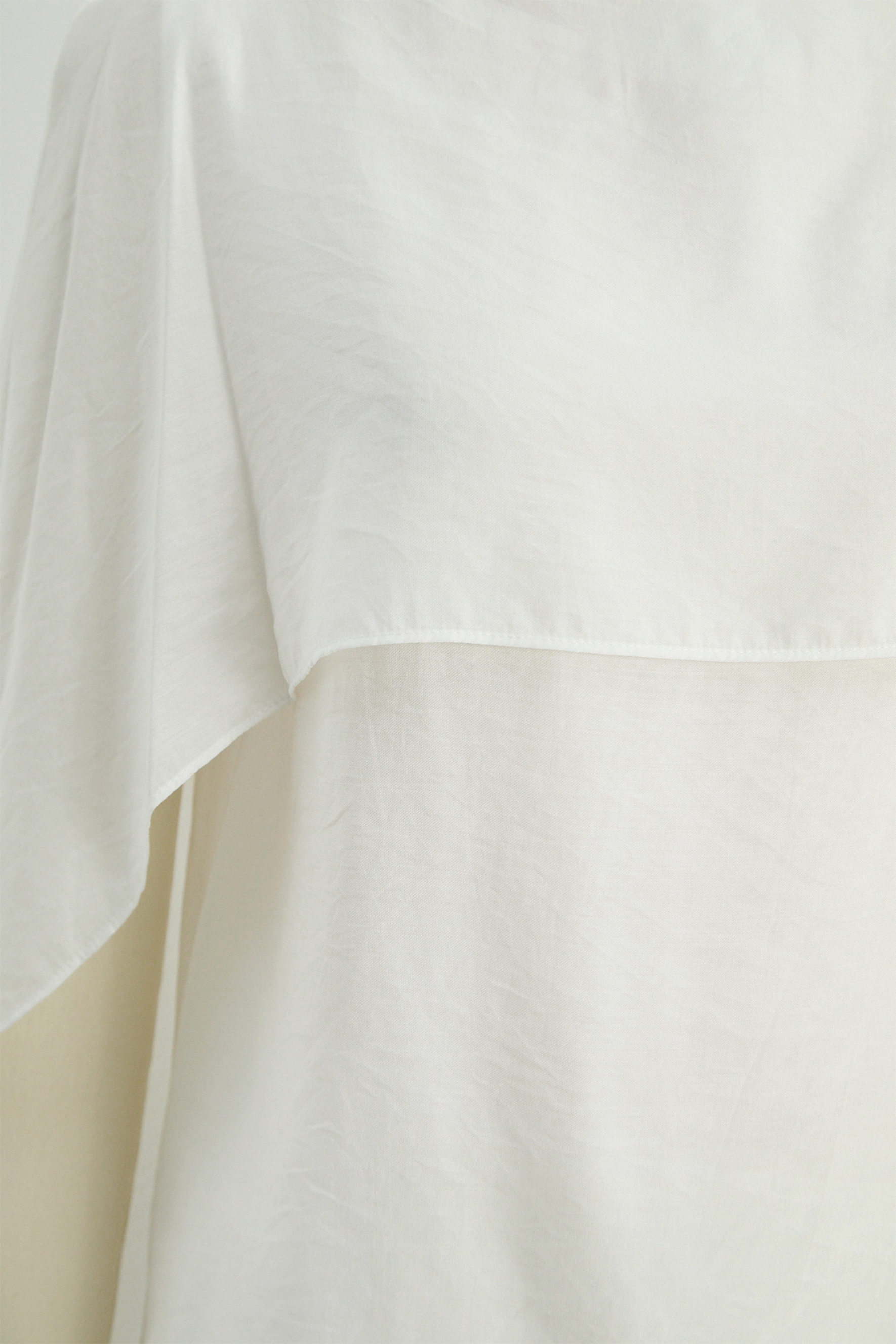 Angel Poise White Layered Capelet Top