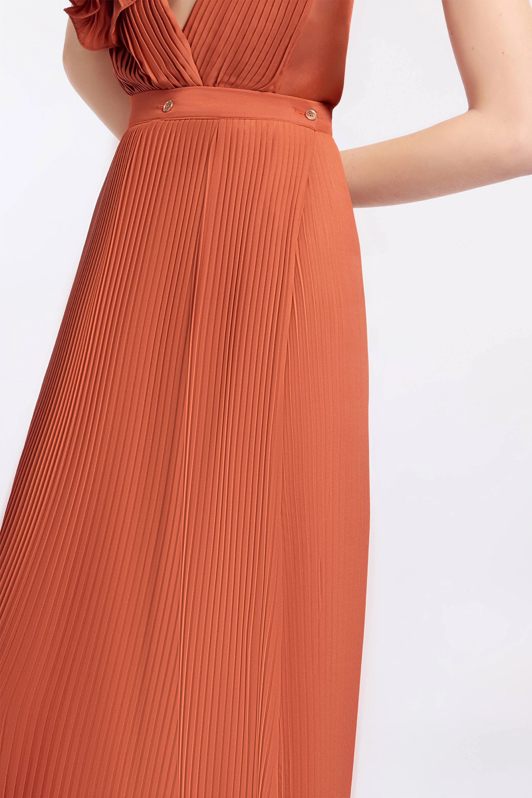 The VIP Vibe Orange V‑Neck Ruffle Top & Pleated Skirt Set