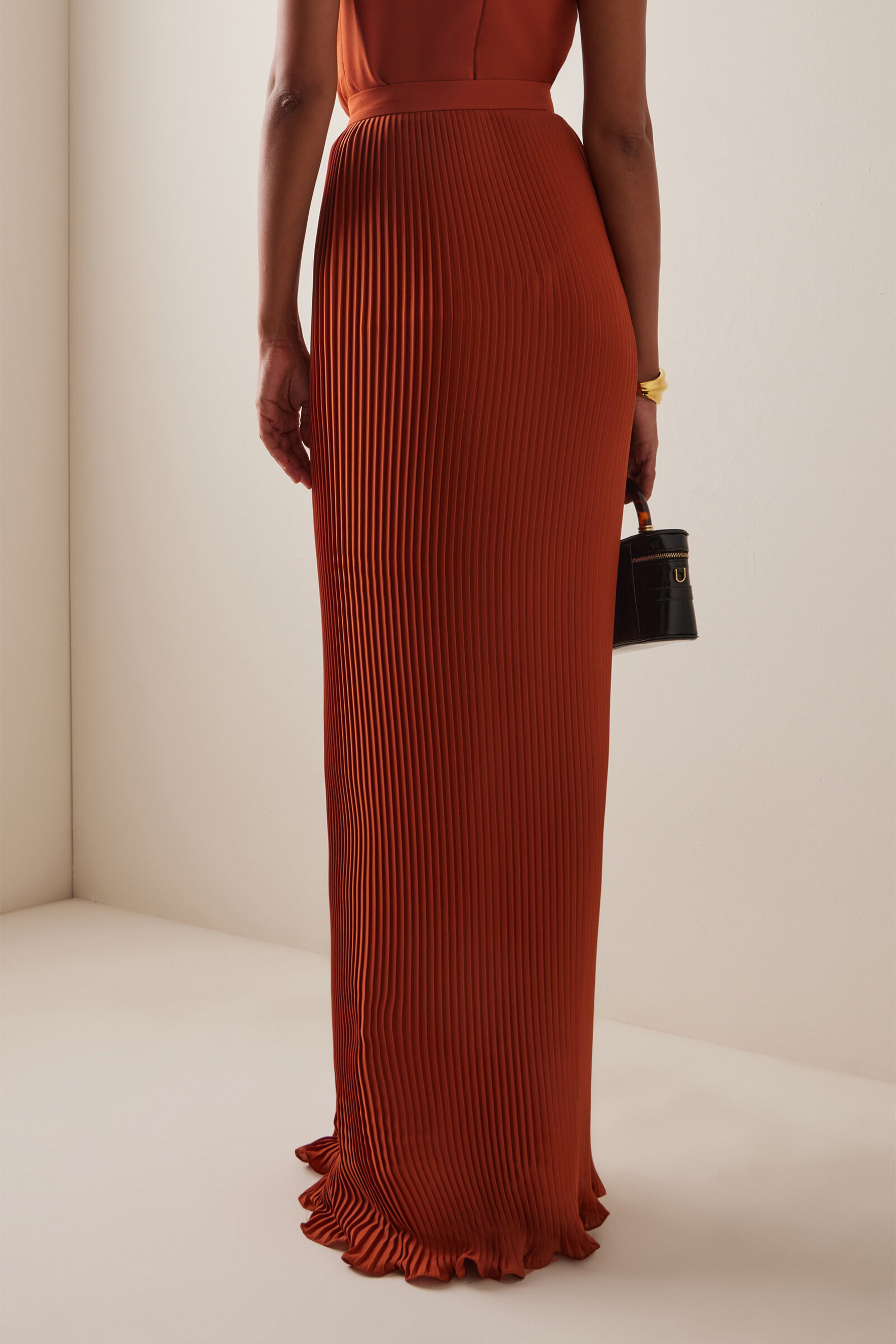 The VIP Vibe Orange V‑Neck Ruffle Top & Pleated Skirt Set