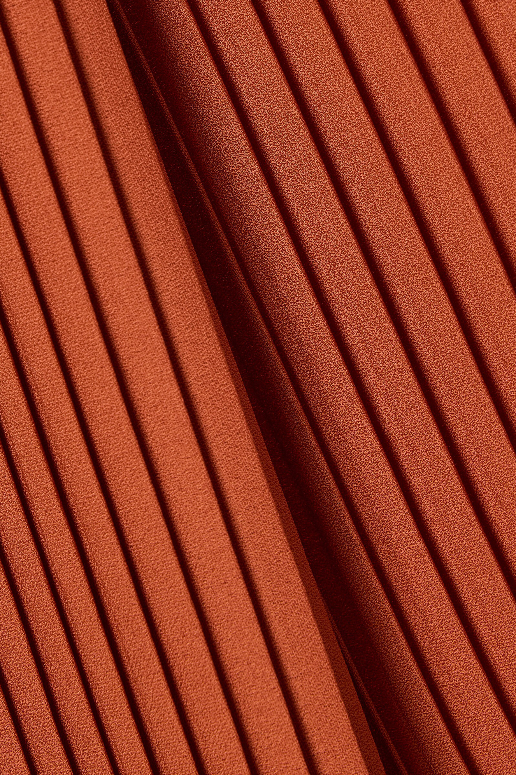 The VIP Vibe Orange V‑Neck Ruffle Top & Pleated Skirt Set