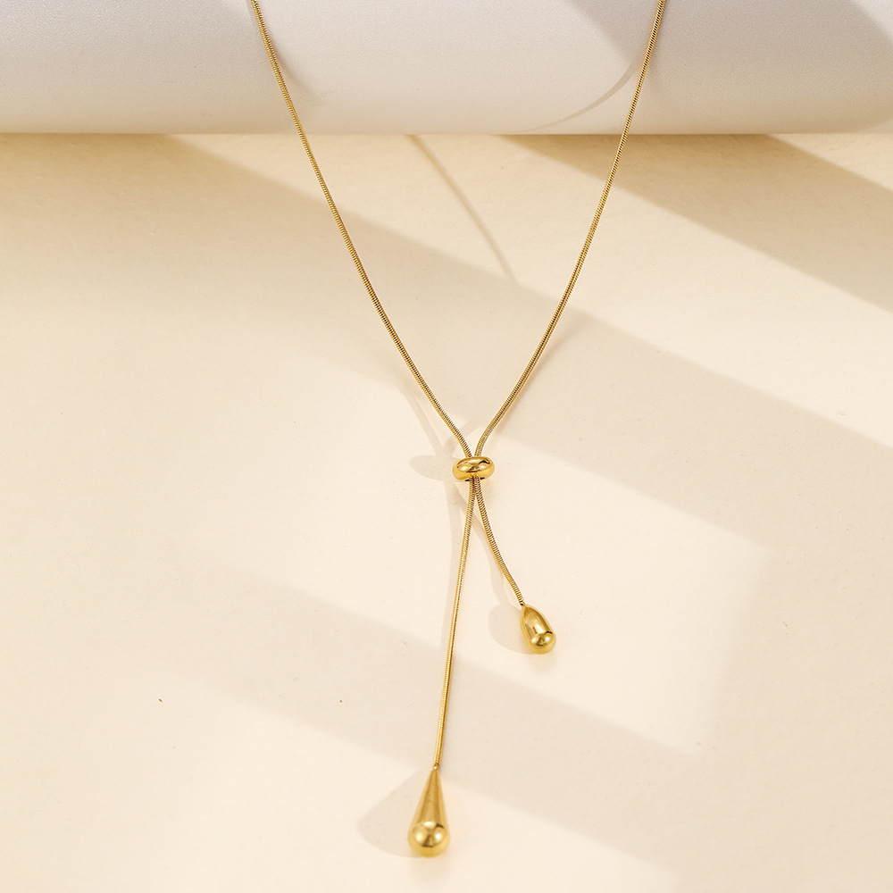 Long Teardrop Necklace — Soft Lines, Golden Elegance