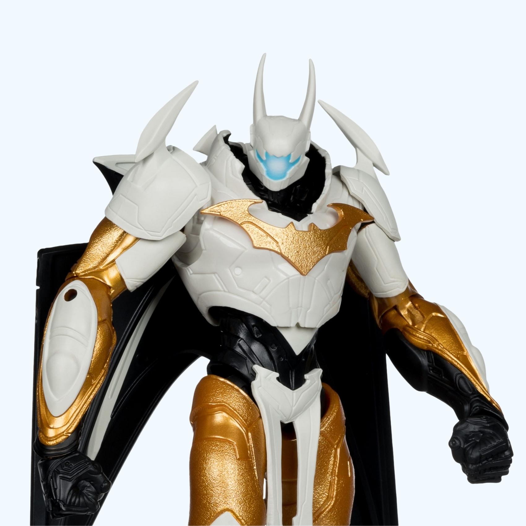 Front close-up shot of Batman Mega action figure with white armour, gold bat emblem and glowing blue visor