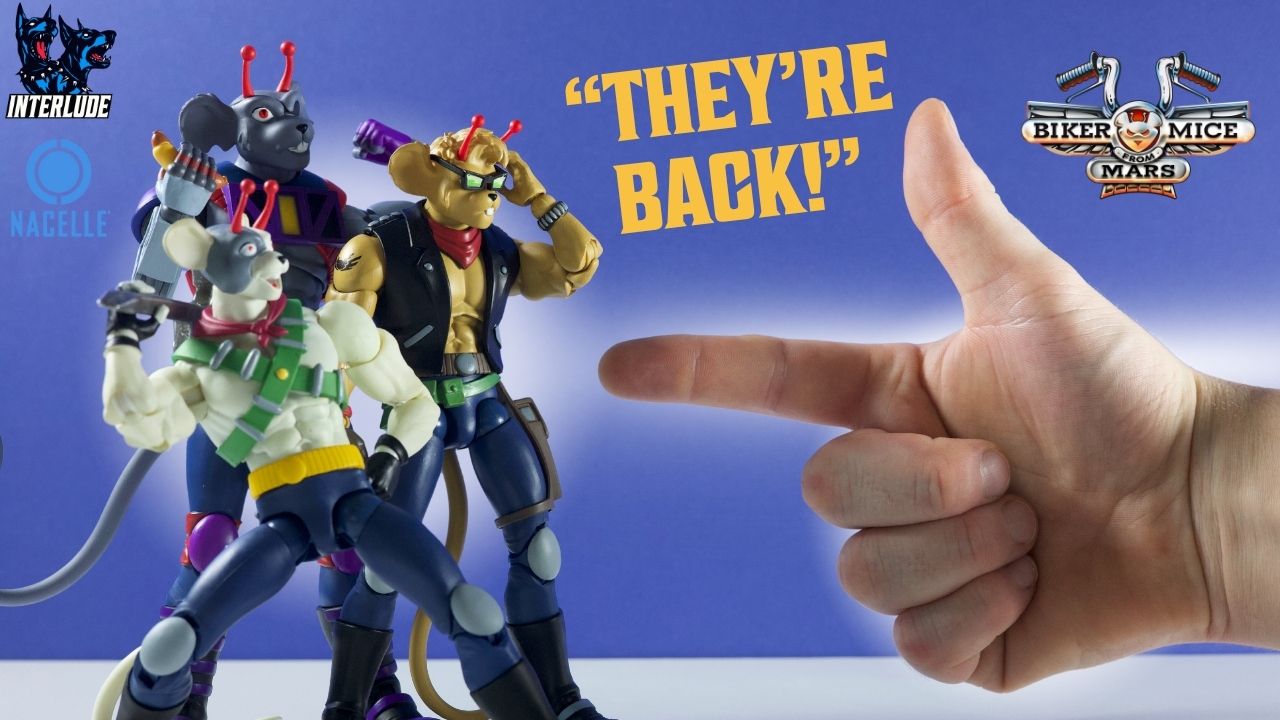 {"default":"Vinnie, Modo, and Throttle action figures from Nacelle's Biker Mice from Mars line posed next to a pointing hand with “They’re Back!” text and Interlude, Nacelle, and Biker Mice from Mars logos"}
