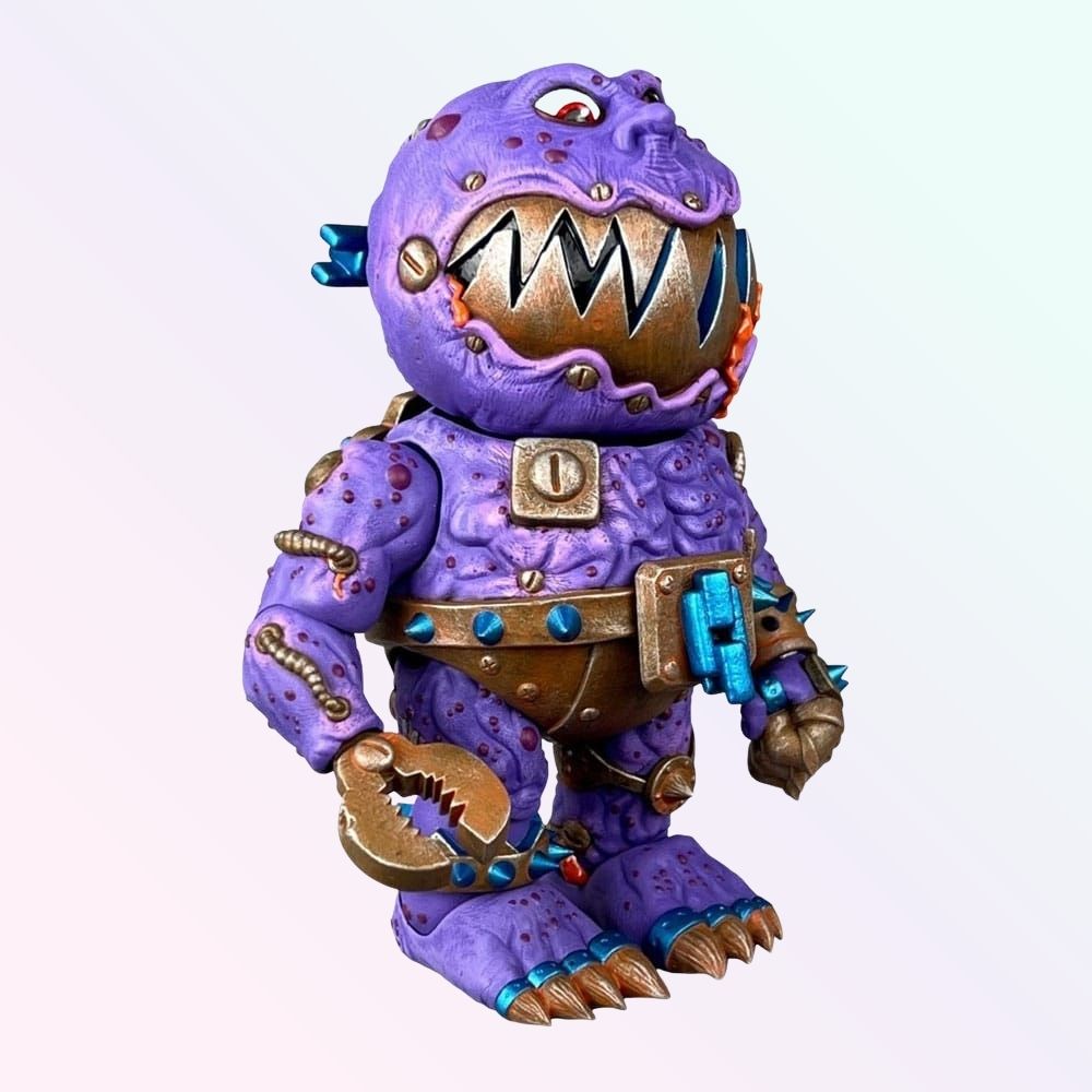 Front angled shot of Clang Fang action figure with jagged metal grin, purple body and bronze armour