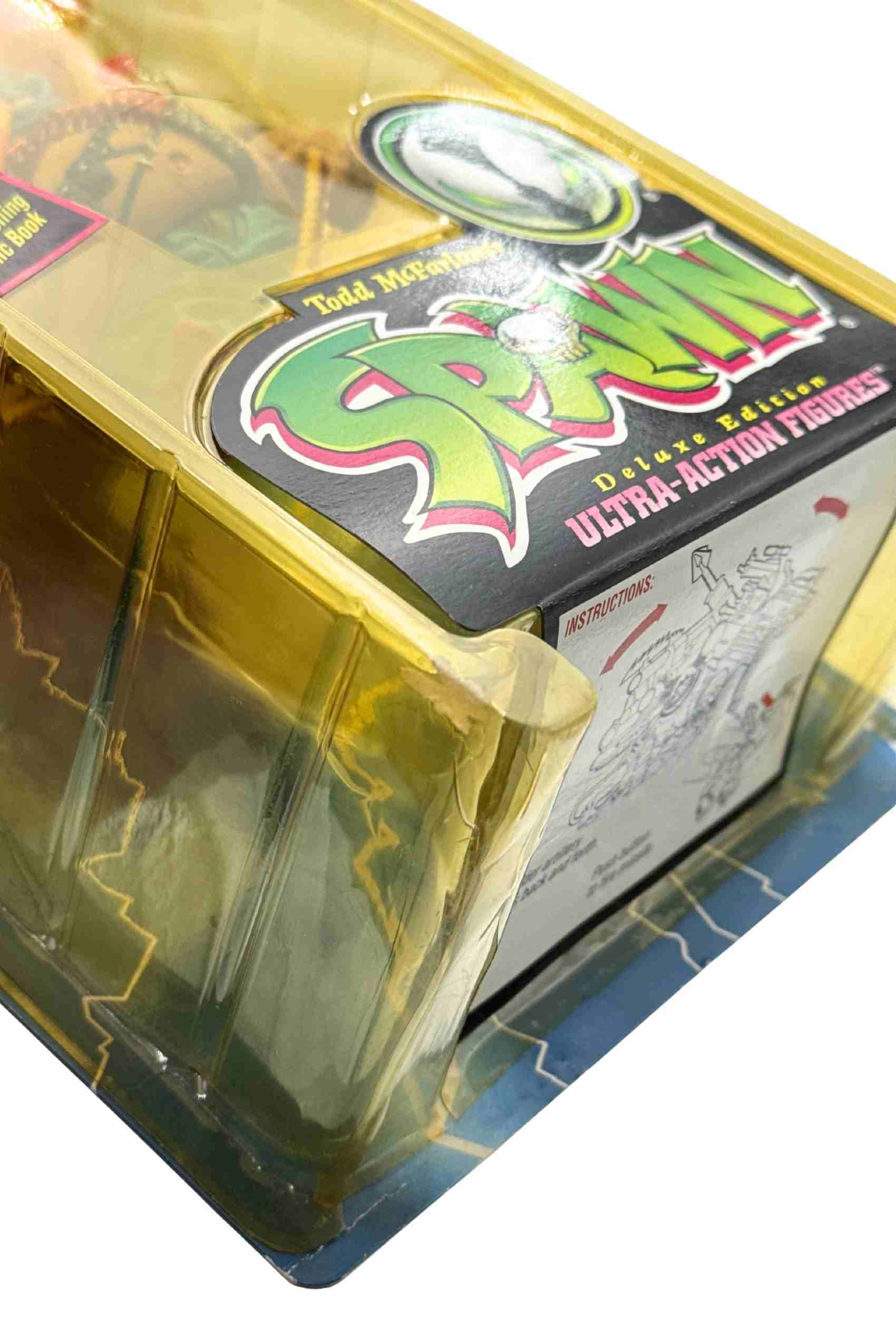 Angled shot of Clown II Spawn action figure inside blister with Spawn Deluxe Edition logo and yellowed plastic bubble