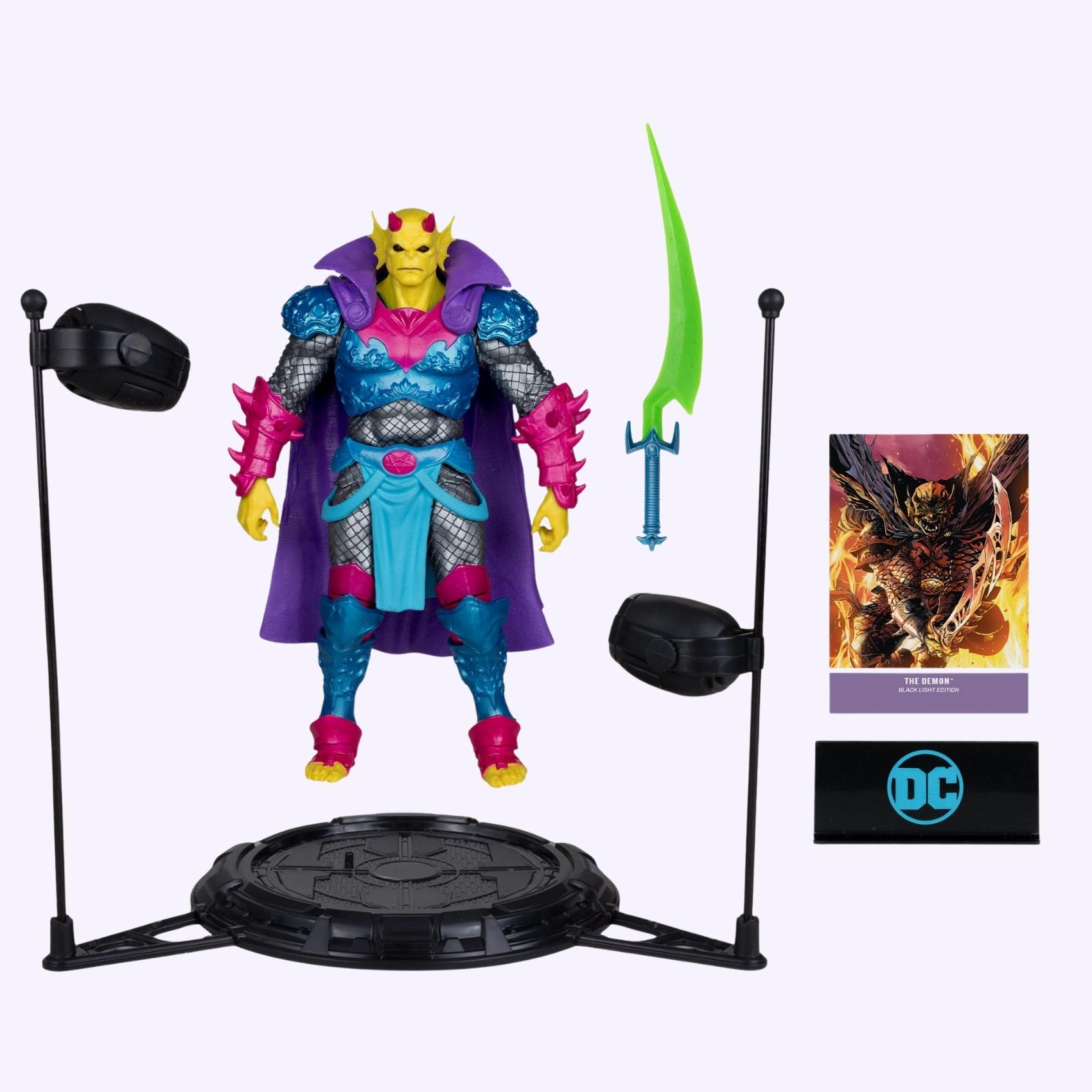 Accessories layout shot of Demon Knights Black Light Edition The Demon action figure with display base, black lights, sword and art card