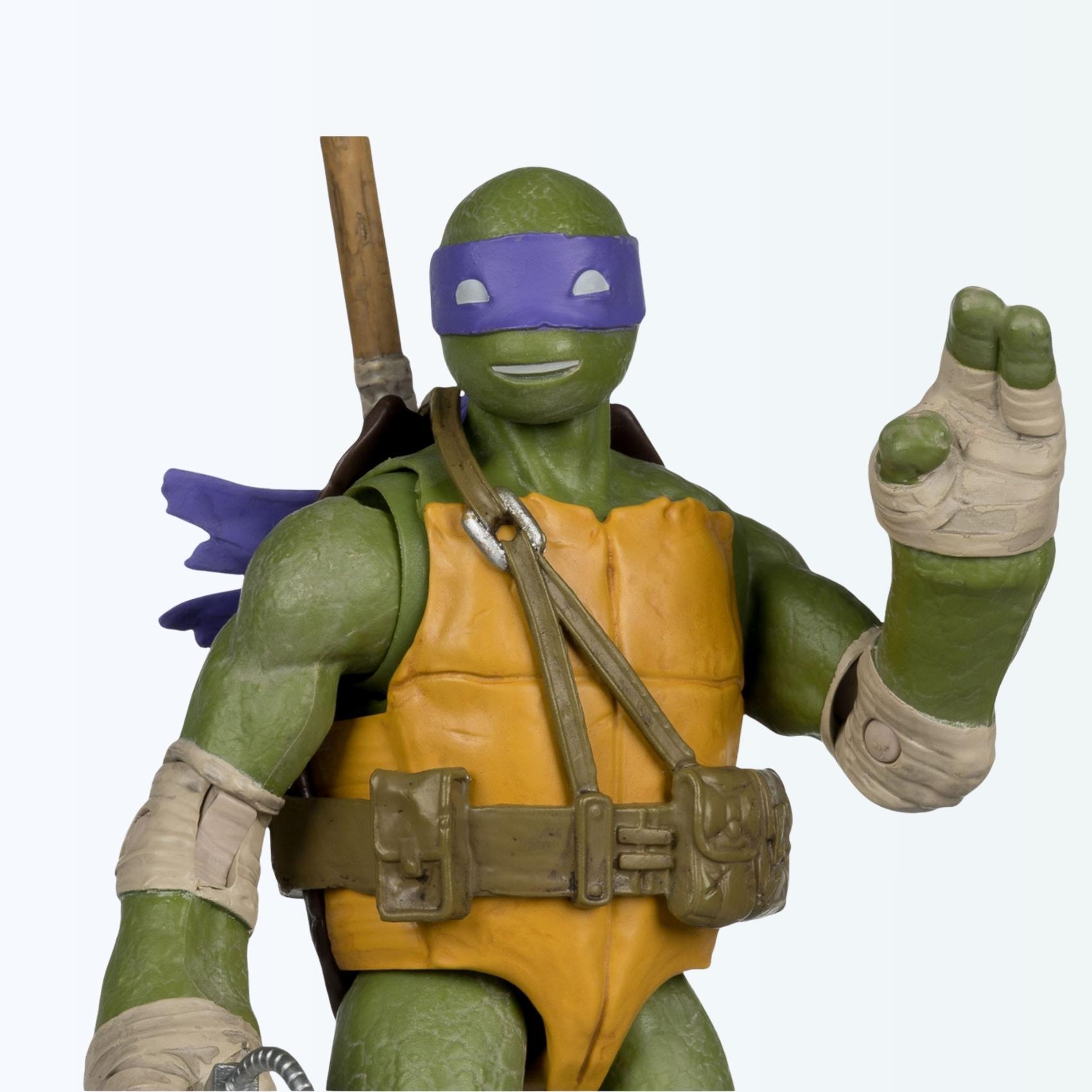 Close-up shot of Donatello action figure waving, with purple bandana tails flowing behind