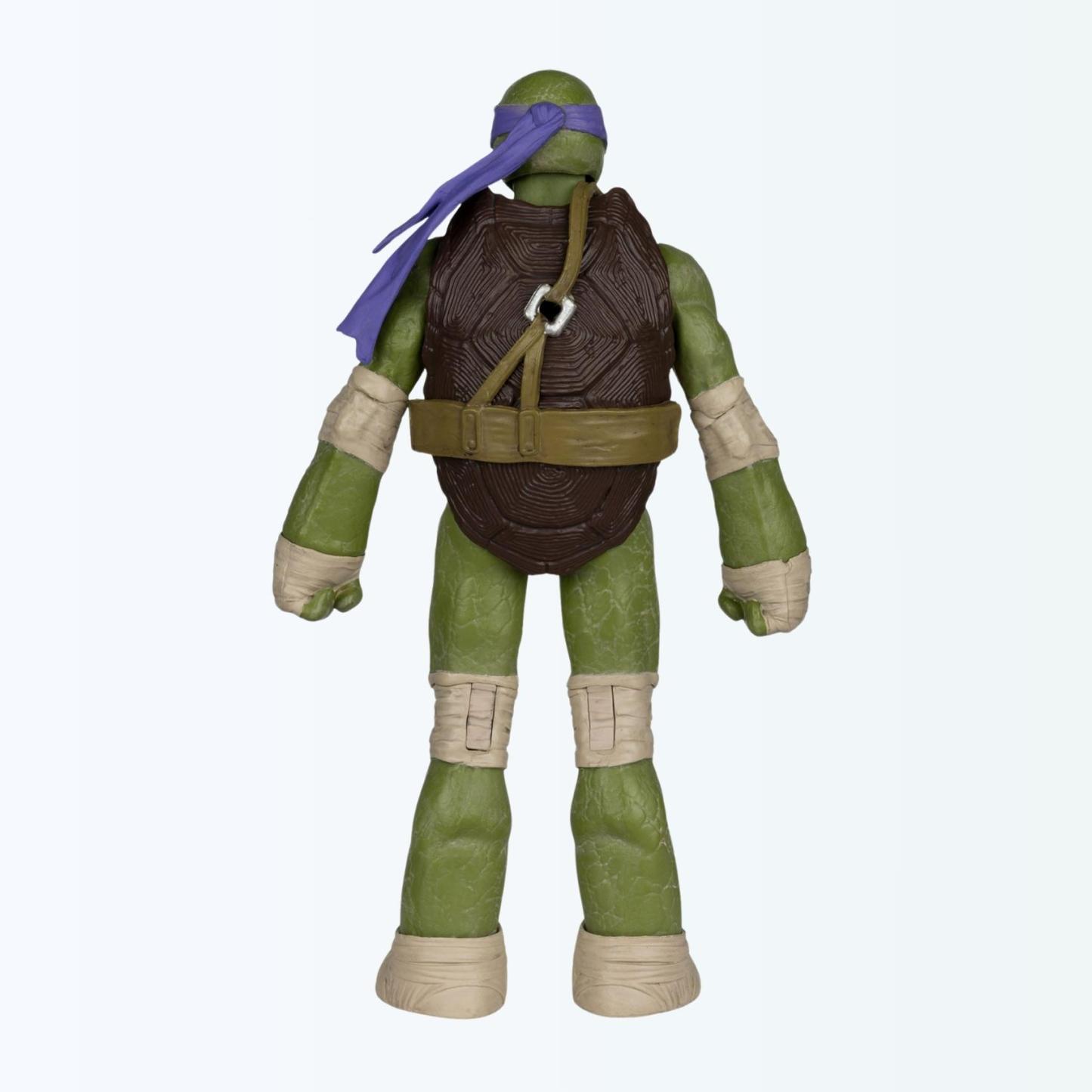 Rear-facing shot of Donatello action figure showing turtle shell and bandana tails