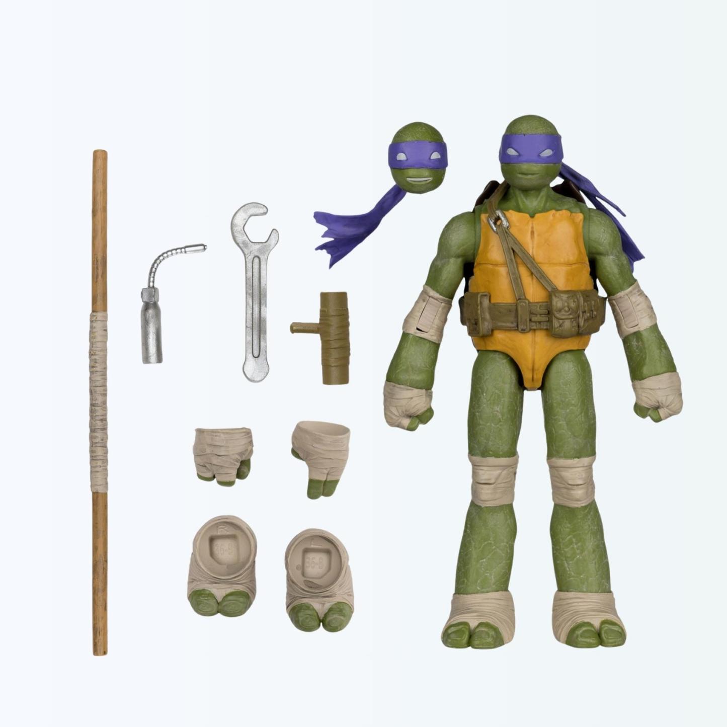 Accessories laid out with Donatello action figure, bo staff, bo staff holder, tools, alternate head and interchangeable hands and feet