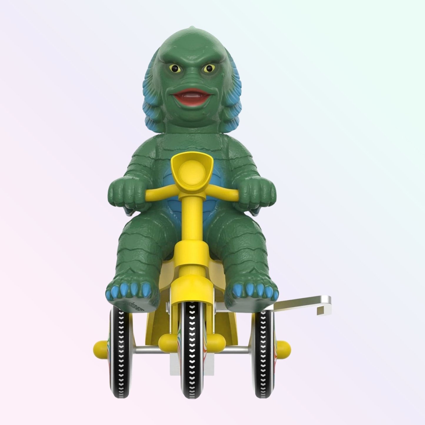 Front-facing shot of Creature from the Black Lagoon figure riding yellow trike