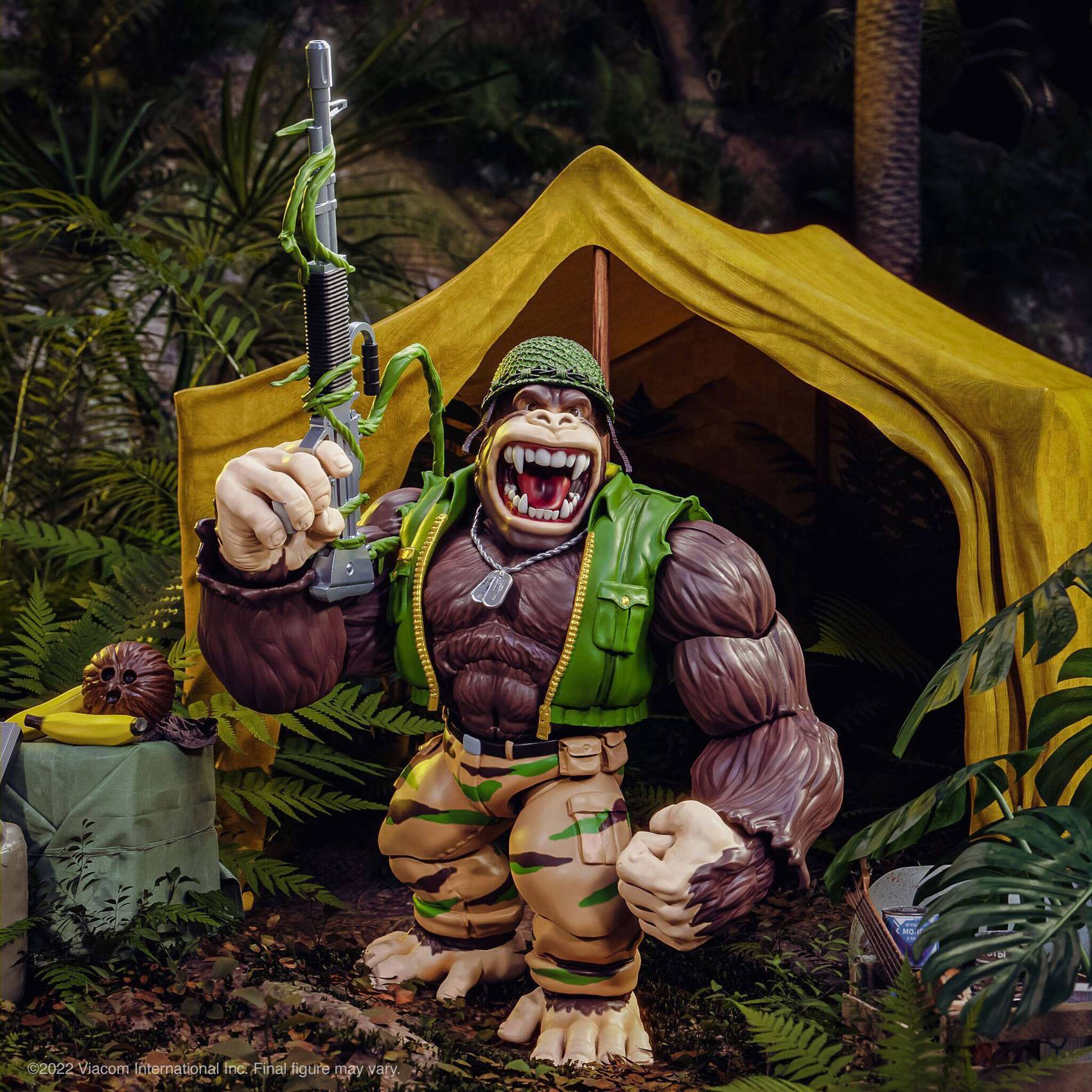 Diorama shot of Guerilla Gorilla action figure roaring outside yellow tent with rifle and helmet equipped