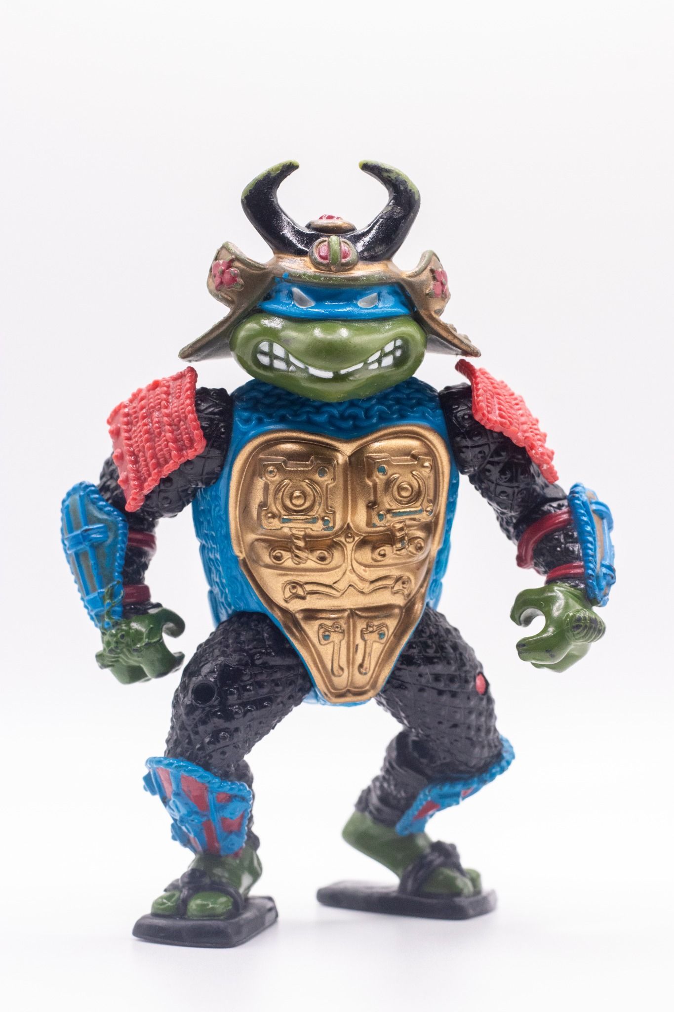 Front-facing shot of Leo, the Sewer Samurai  action figure with gold chest armour and kabuto helmet