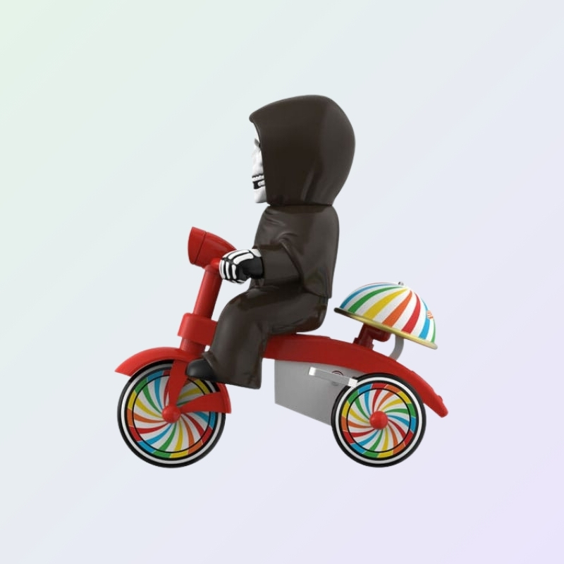 Side profile of Misfits The Fiend figure on tricycle with umbrella-striped dome over rear wheels