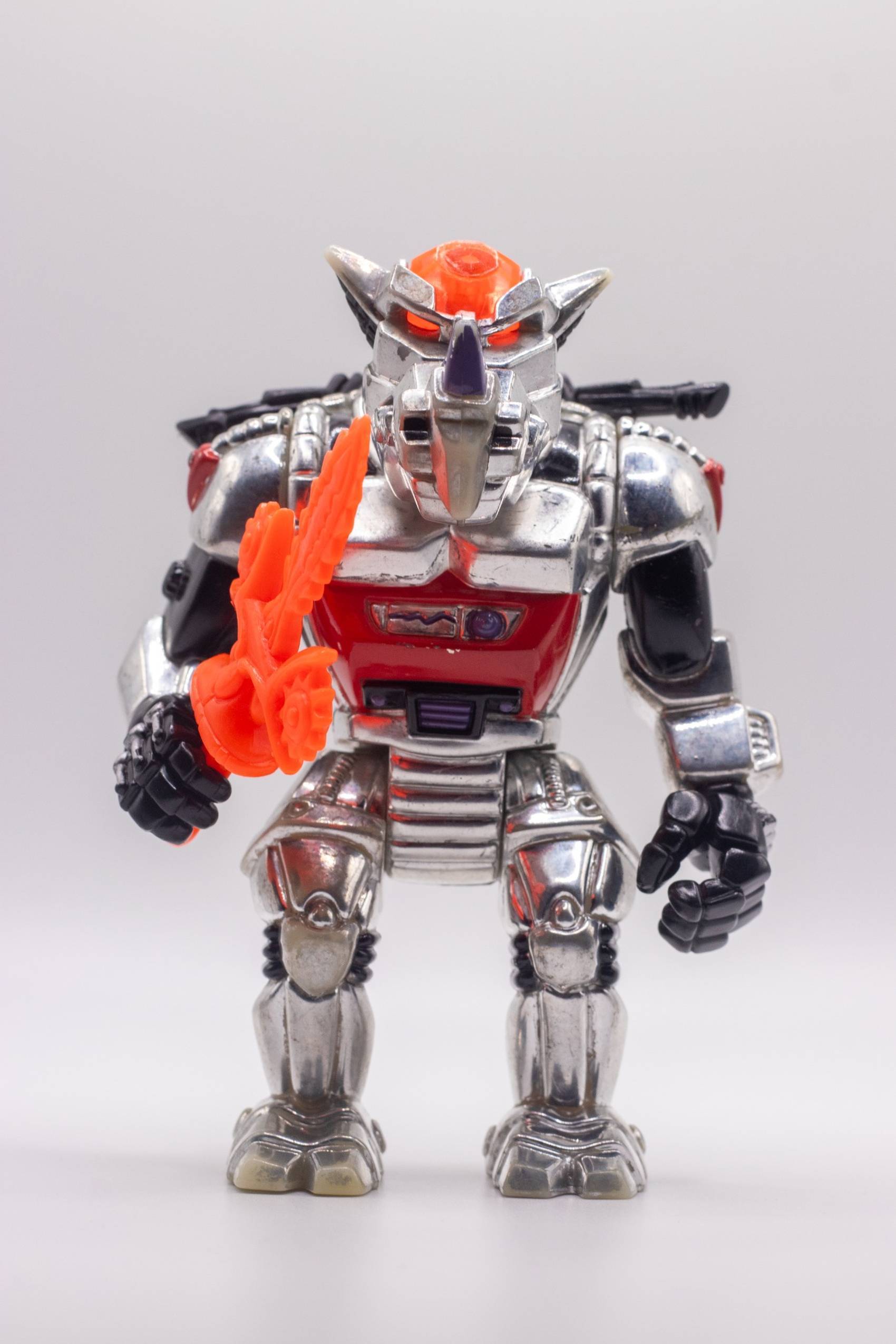 Head-on shot of Robotic Rocksteady action figure gripping Chilling Chainsaw Sword in a forward pose