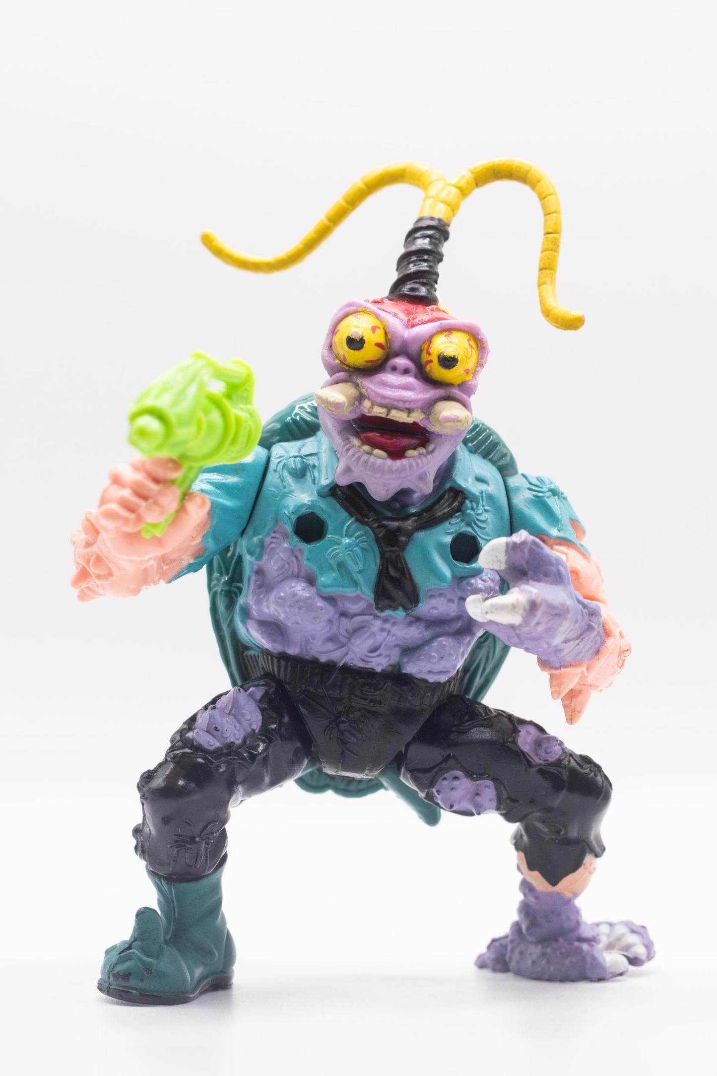 Front-facing shot of Scumbug action figure aiming Turtle Exterminating Gun