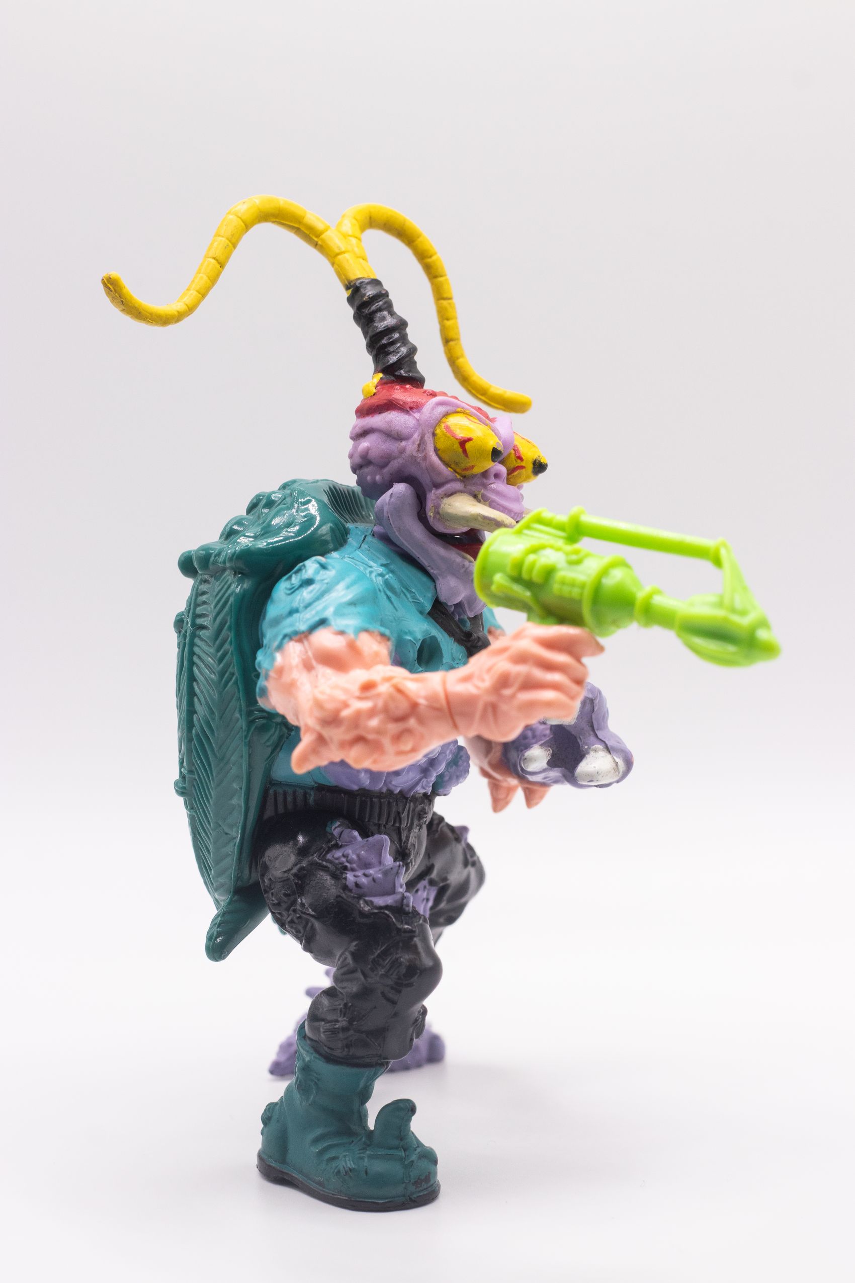 Right-angled shot of Scumbug action figure aiming Turtle Exterminating Gun