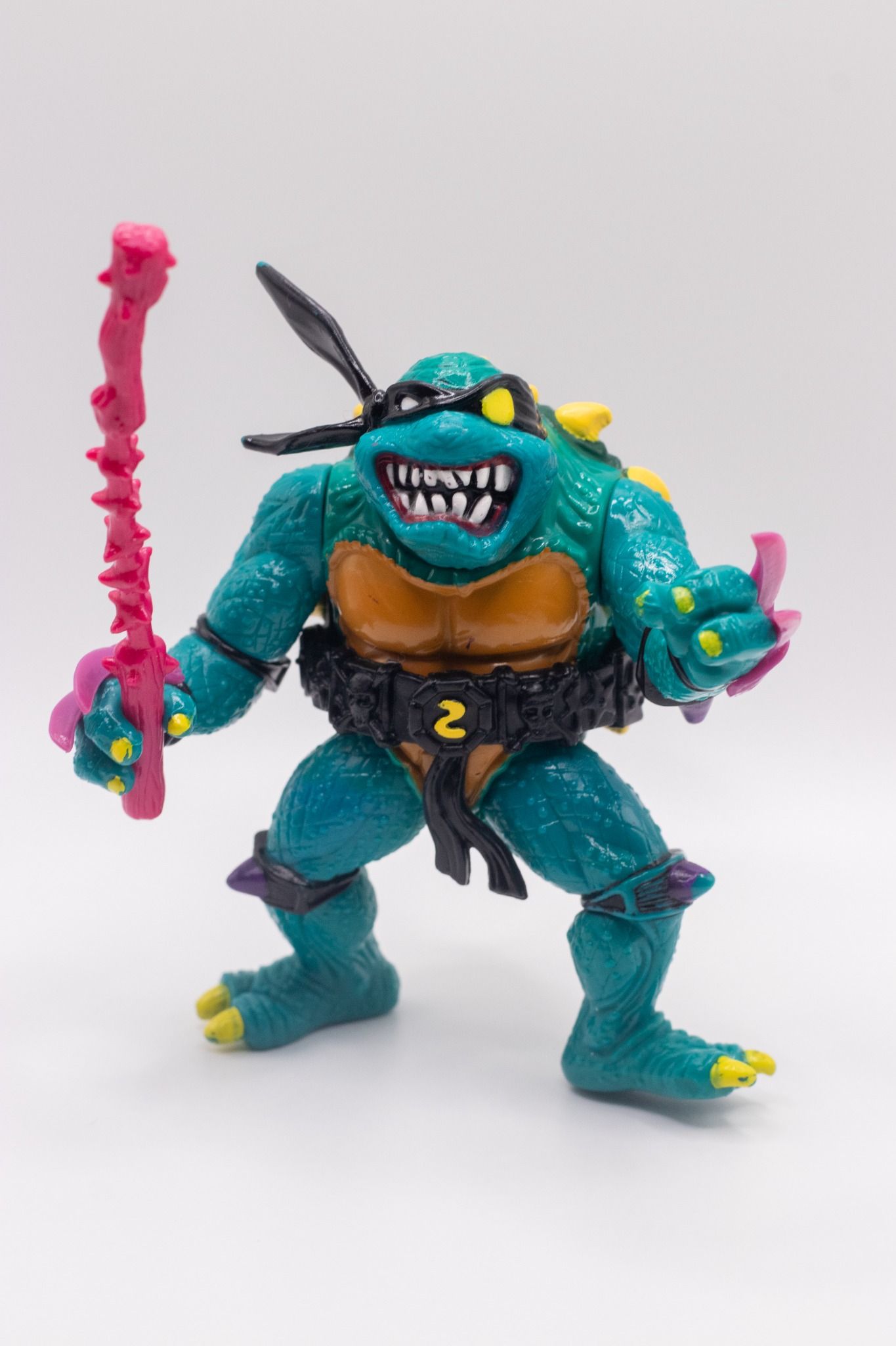 Front-facing shot of TMNT Slash action figure holding Nasty Nunchaku accessory