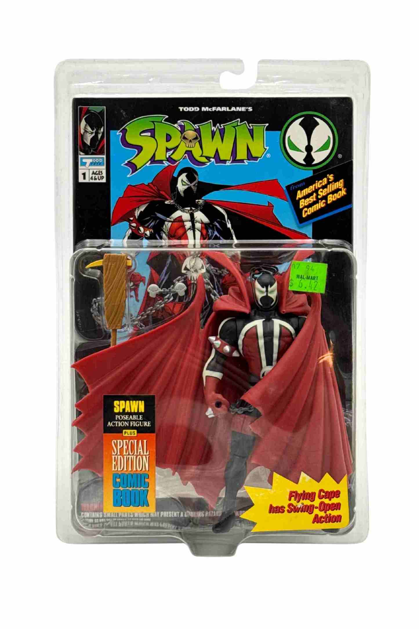 Front carded shot of Spawn Flying Cape action figure with swing-open red cape and comic book in blister packaging