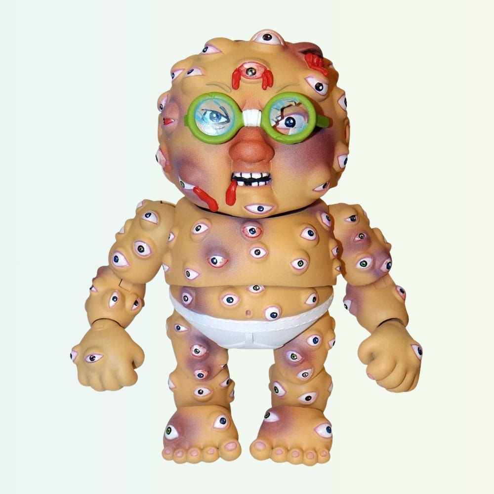 Front shot of Starin' Darren action figure with green glasses and multiple eyeballs