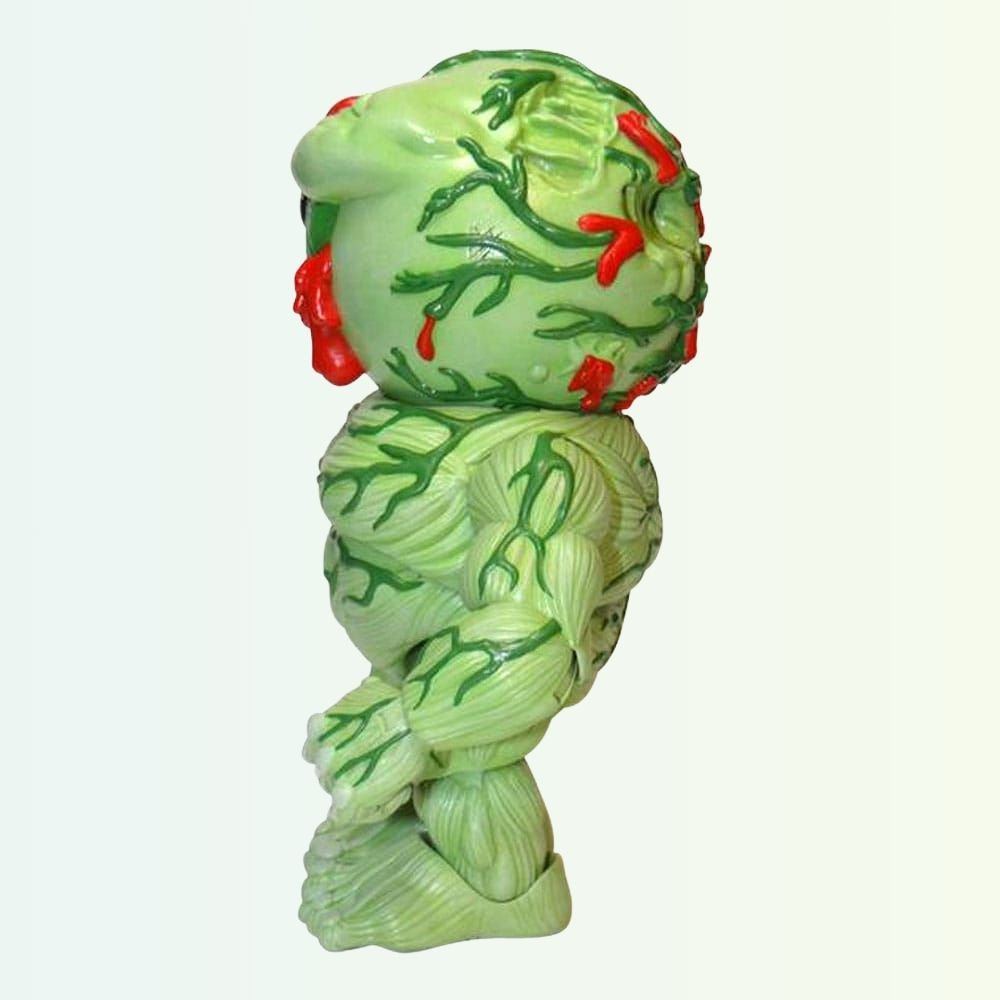 Side angle of Oculus Orbus action figure with green veins and muscle sculpt