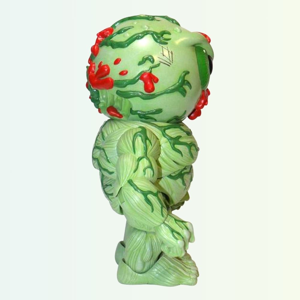 Side angle of Oculus Orbus action figure with blood splatter and muscle detail