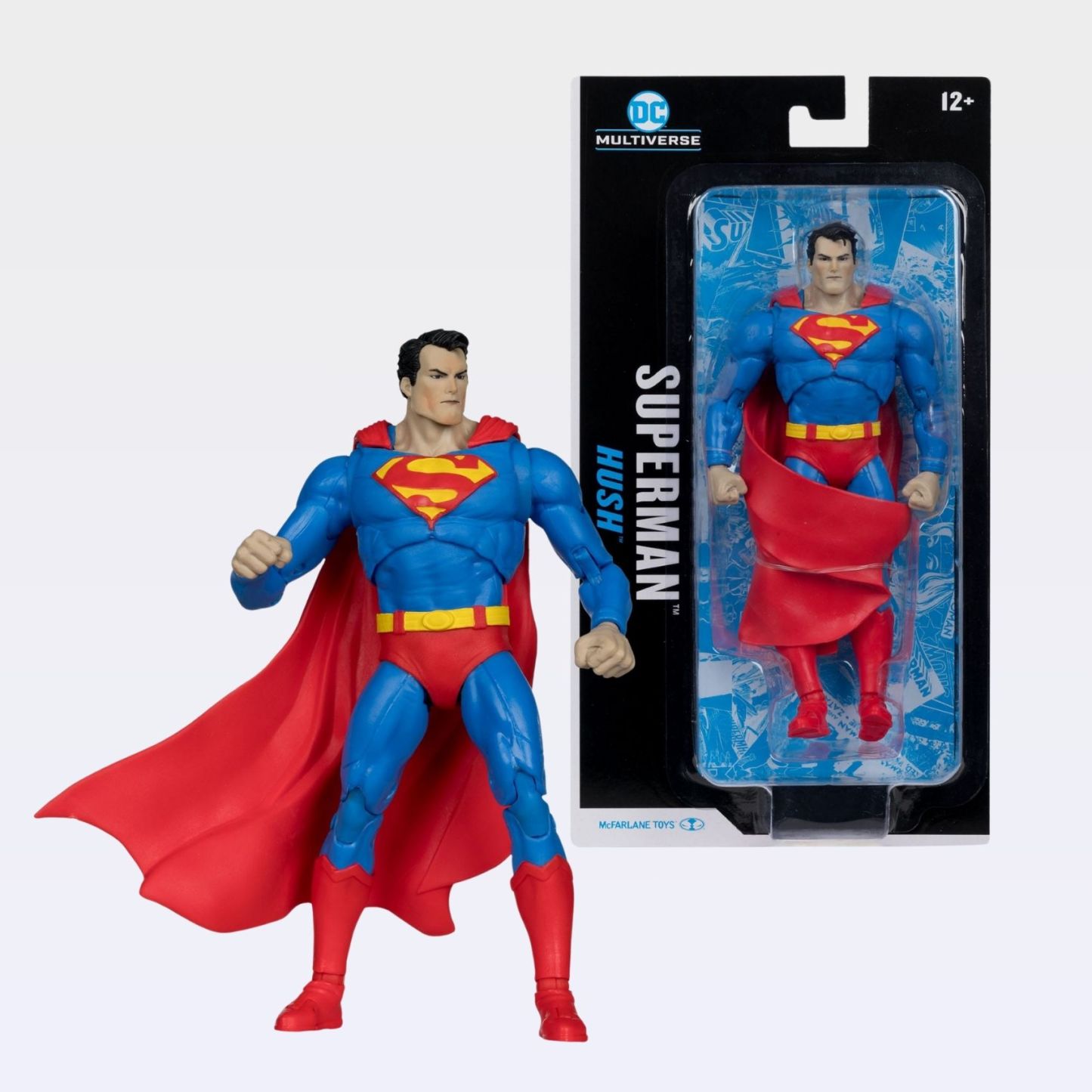 Front-angle shot of Superman Hush action figure standing beside blister-card packaging