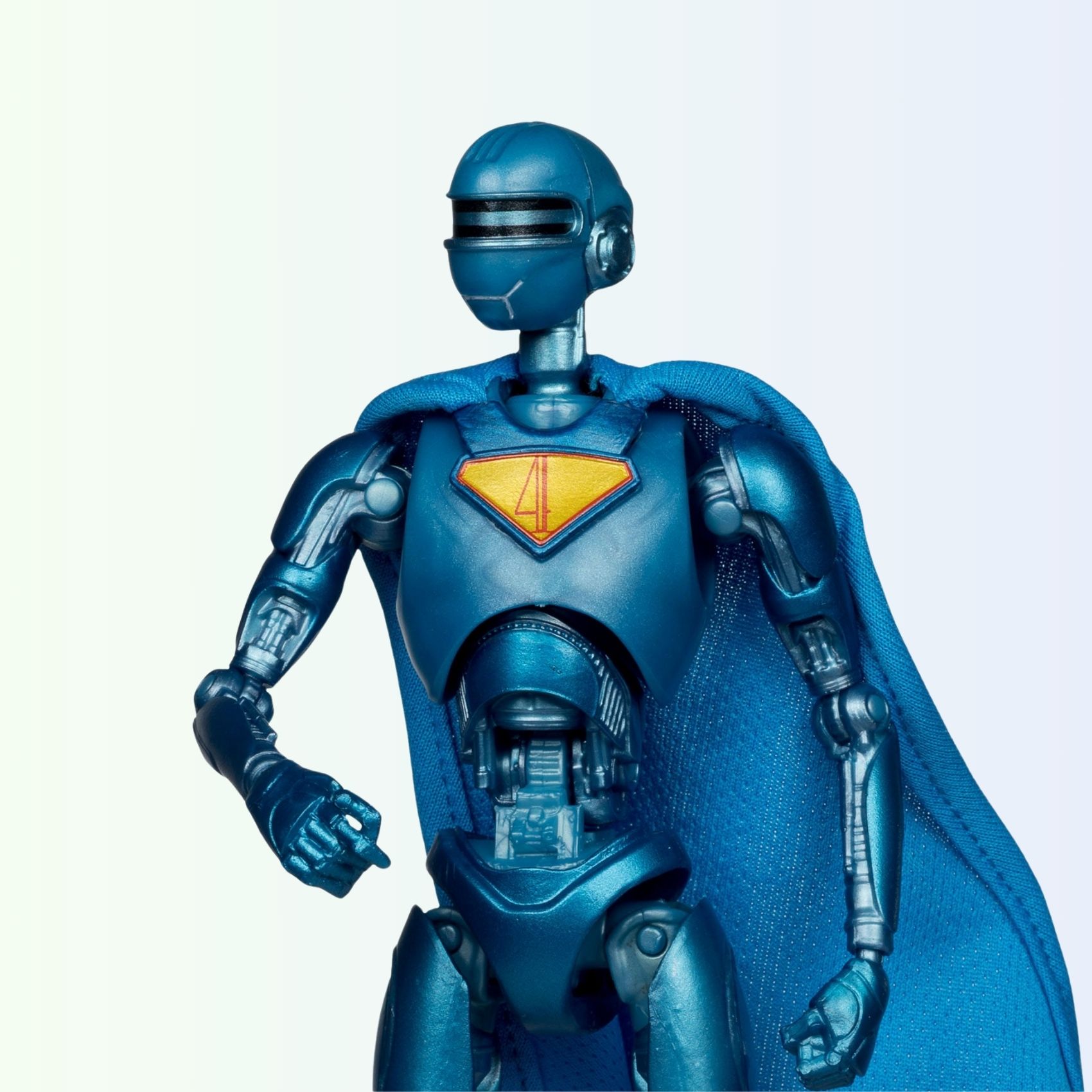 Close-up shot of Superman Robot action figure upper half, showing metallic detail and number 4 emblem